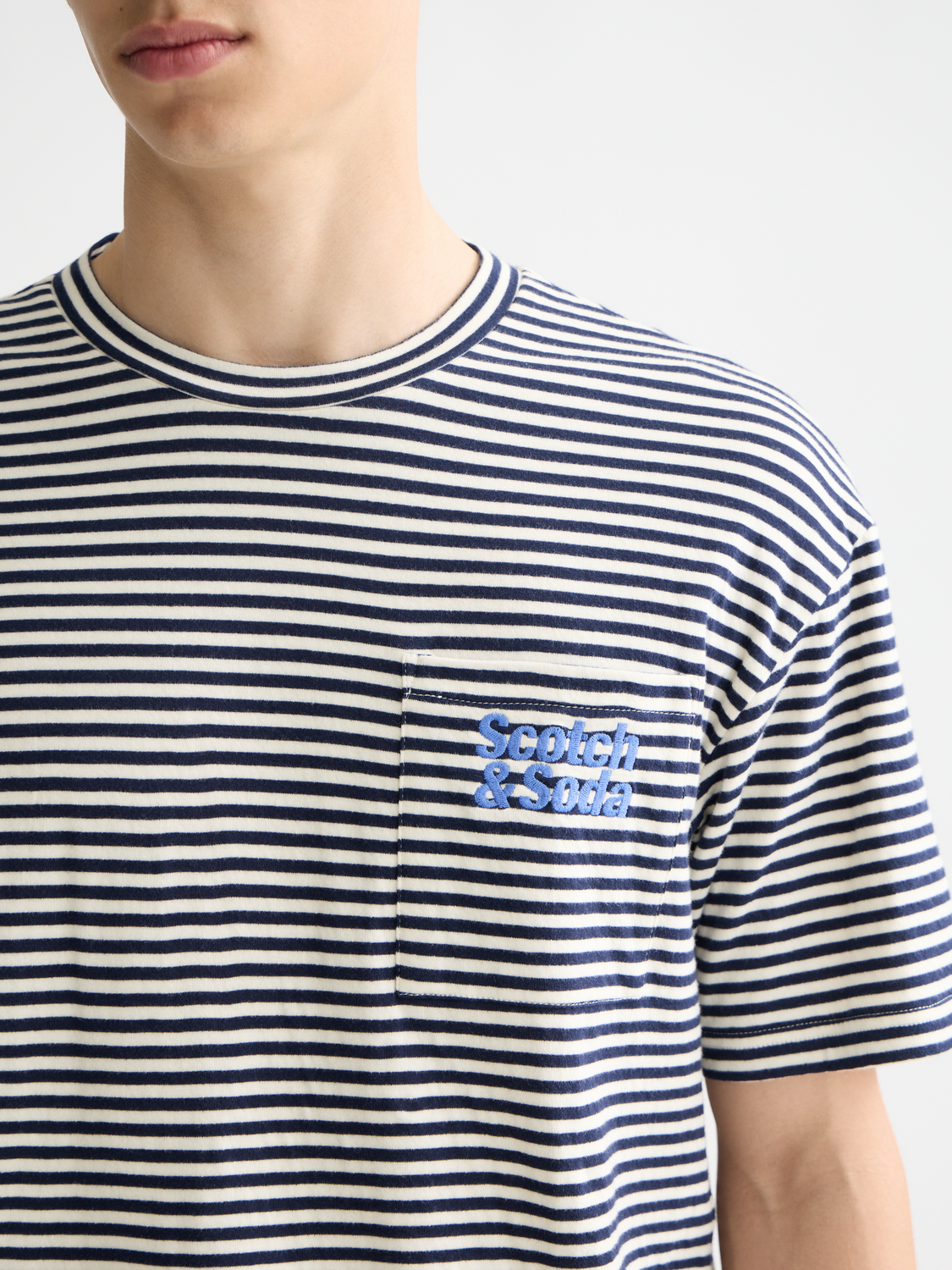 Double face pocket T-shirt from Scotch & Soda, short sleeve tee with contrasting fabric and front pockets.