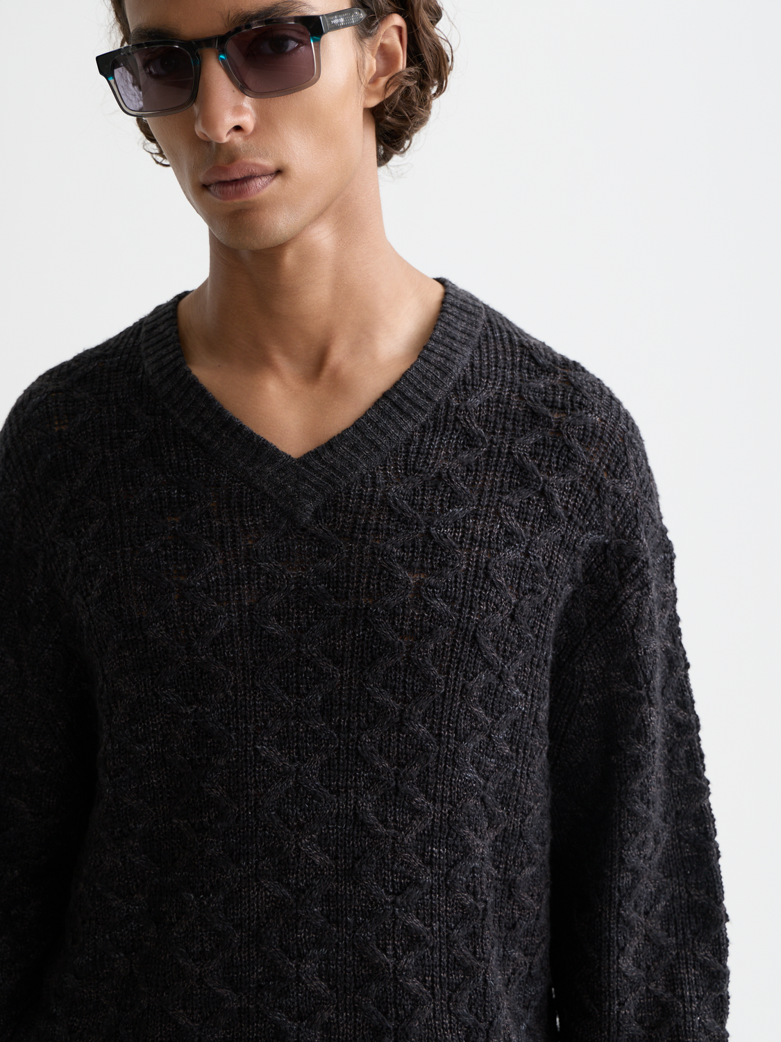 SCOTCH & SODA V-neck cable knit pullover, cozy knitwear with textured cable pattern, in a neutral color.