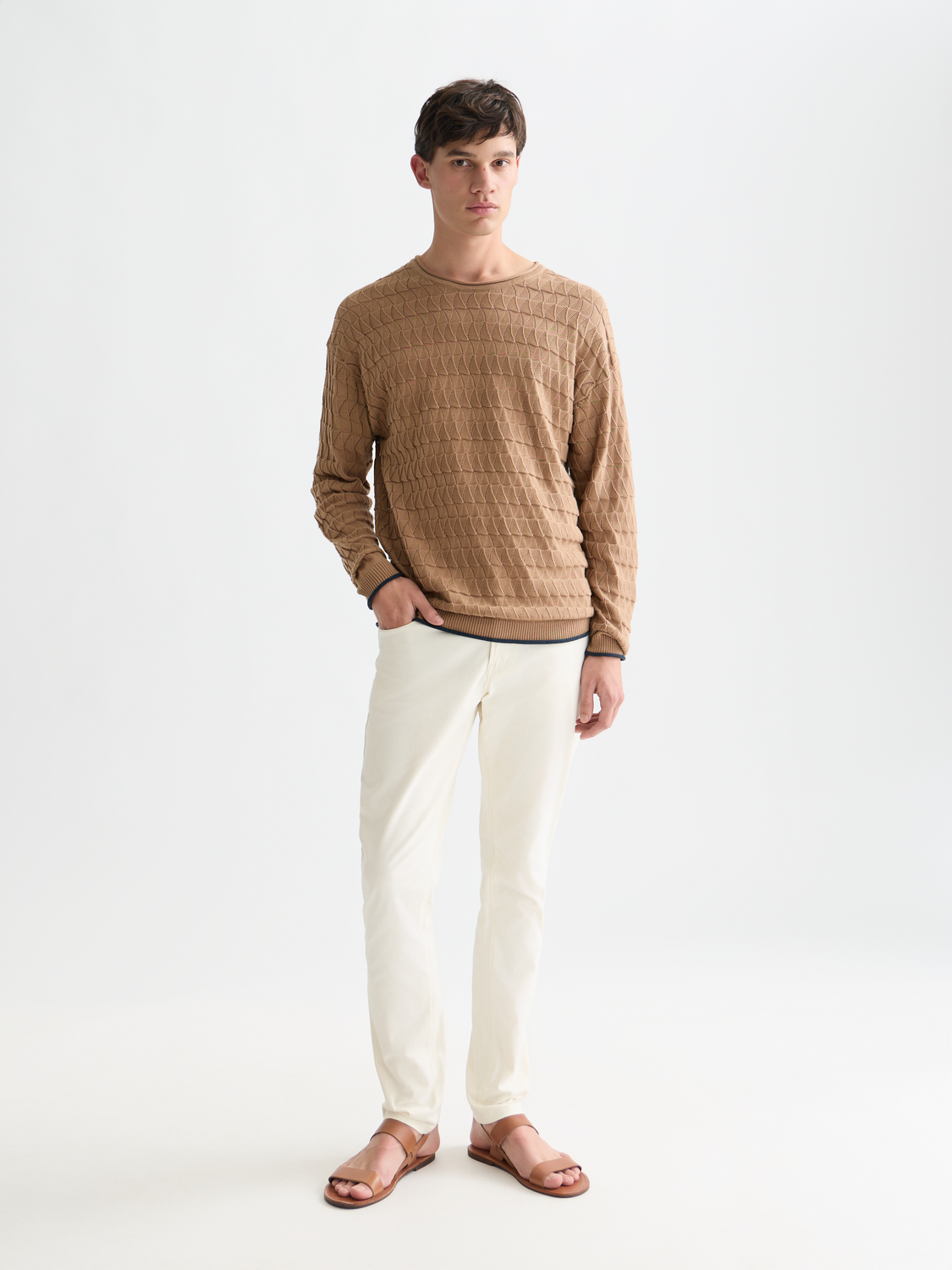 Pointelle knit pullover by Scotch & Soda featuring delicate openwork patterns and a cozy fit, shown in a soft color.