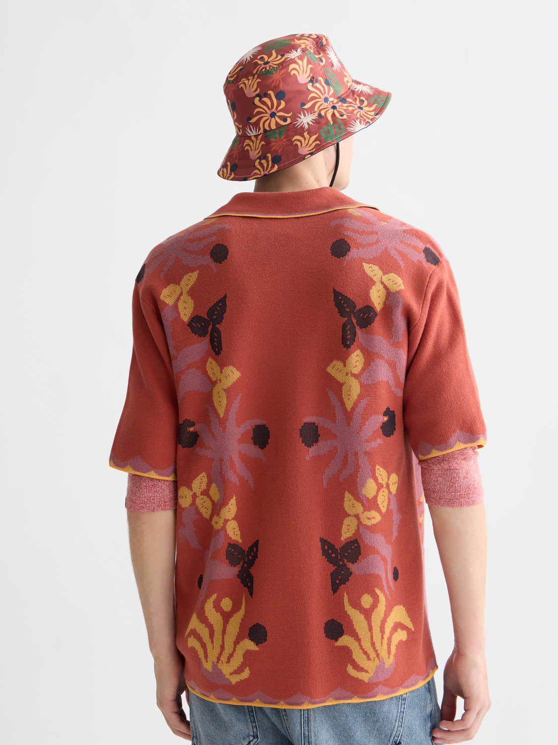 Knitted jacquard short-sleeved shirt by Scotch & Soda, featuring intricate pattern and soft knit fabric, shown from the back.