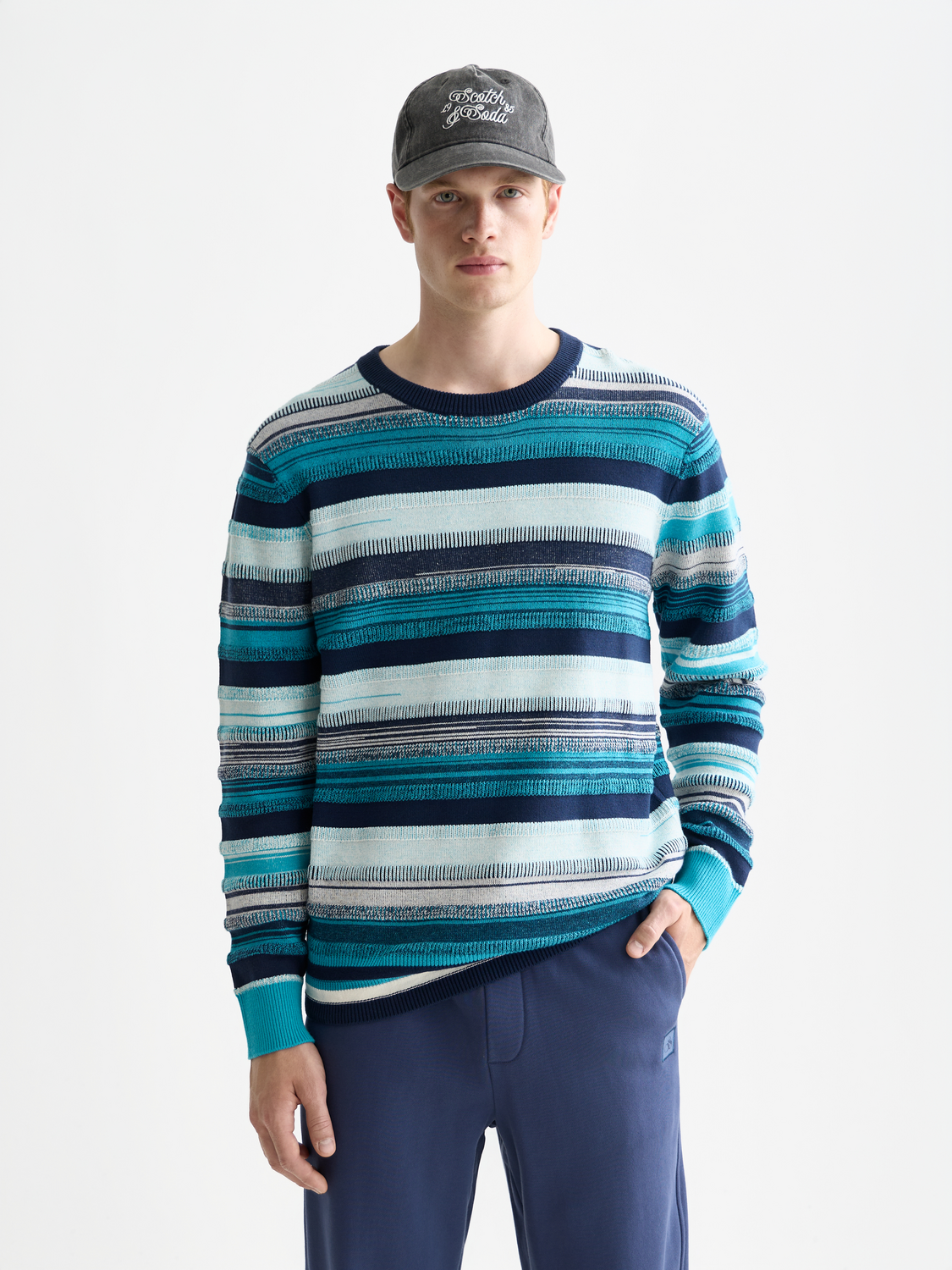 Striped Scotch & Soda knitwear pullover with crew neck and long sleeves, featuring multicolored horizontal stripes.