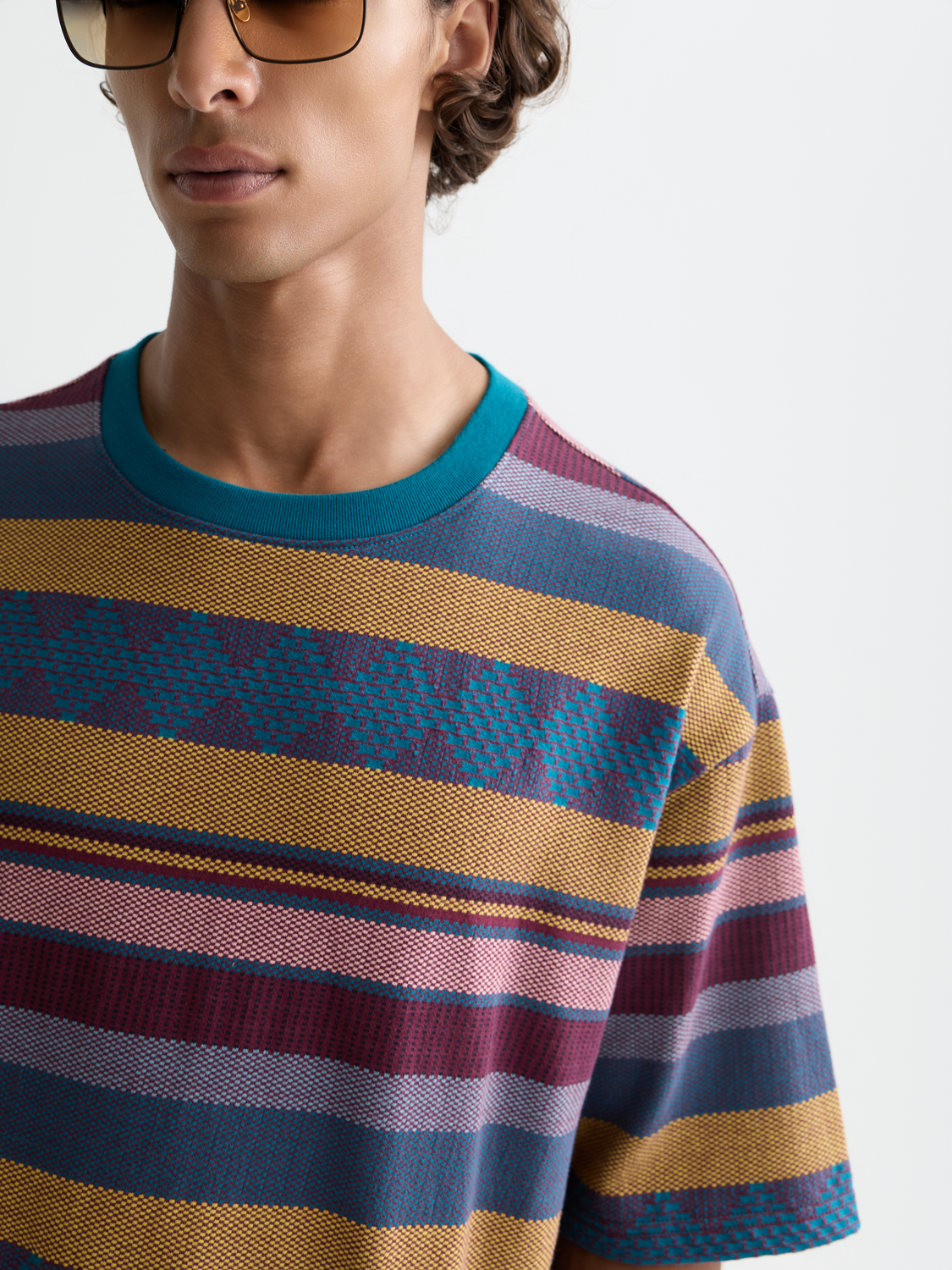 Jacquard knitted Scotch & Soda short sleeve T-shirt with intricate woven pattern on a neutral background.