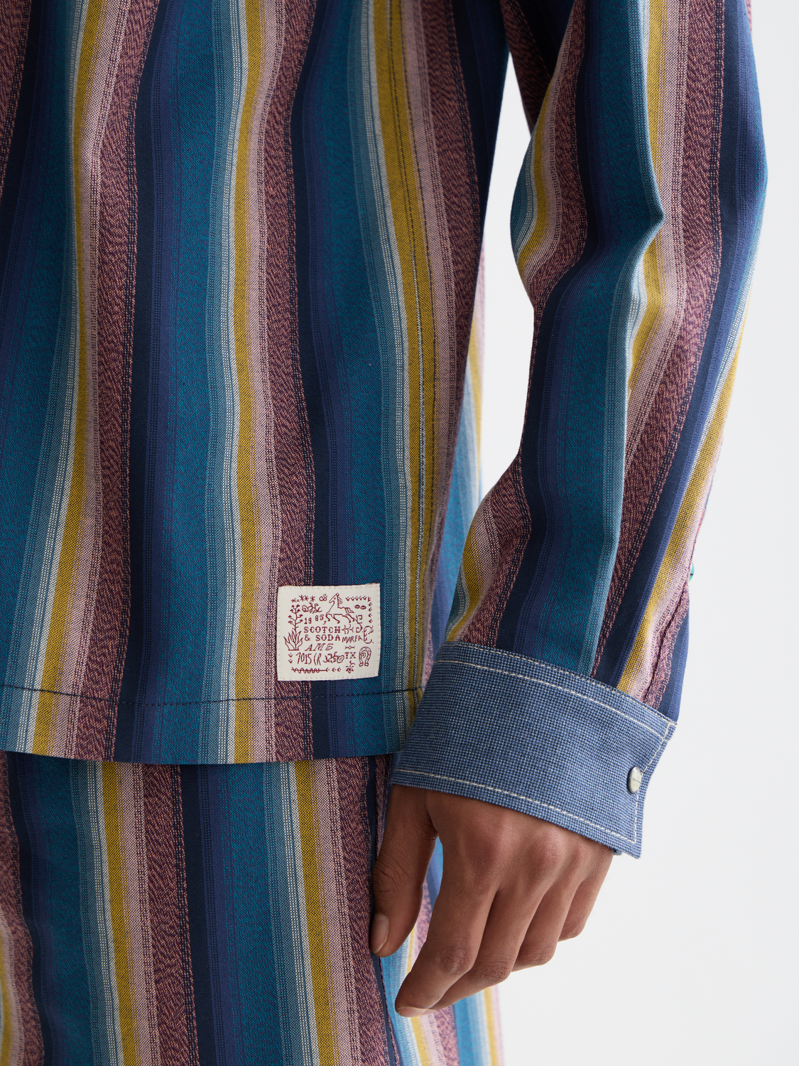 Striped Scotch & Soda long sleeve western shirt with button-up front and classic collar, showcasing blue and white stripes.