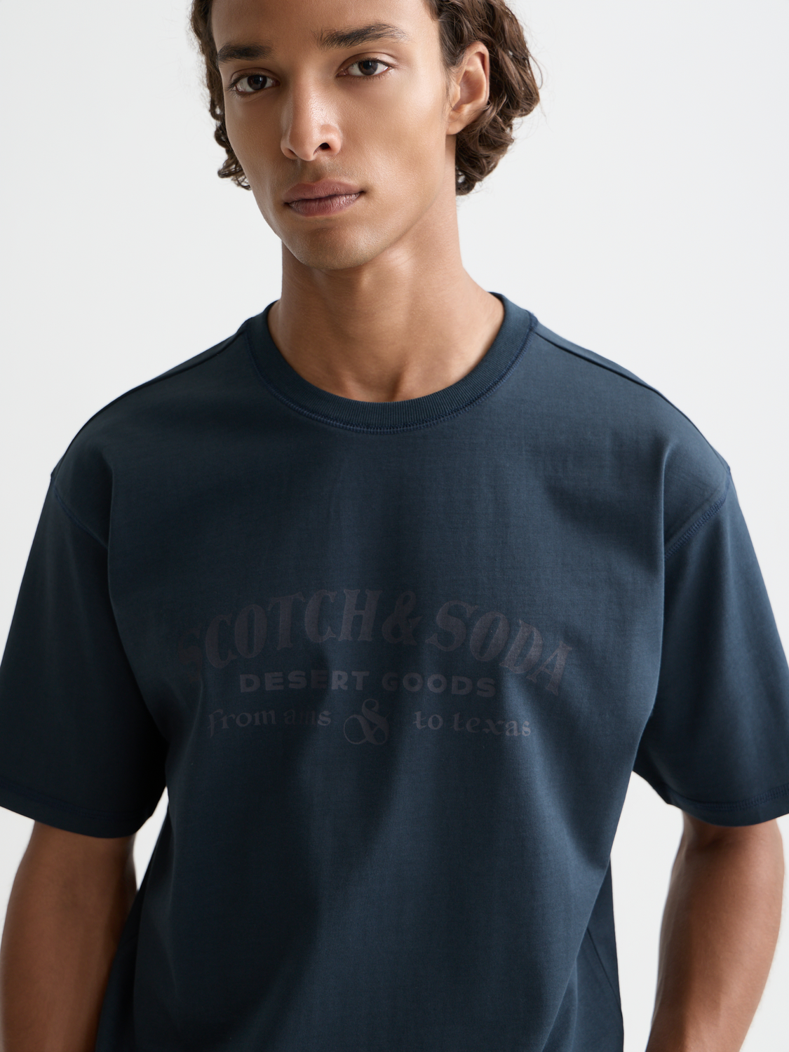 Scotch & Soda short sleeve artwork t-shirt with colorful graphic design on white fabric.