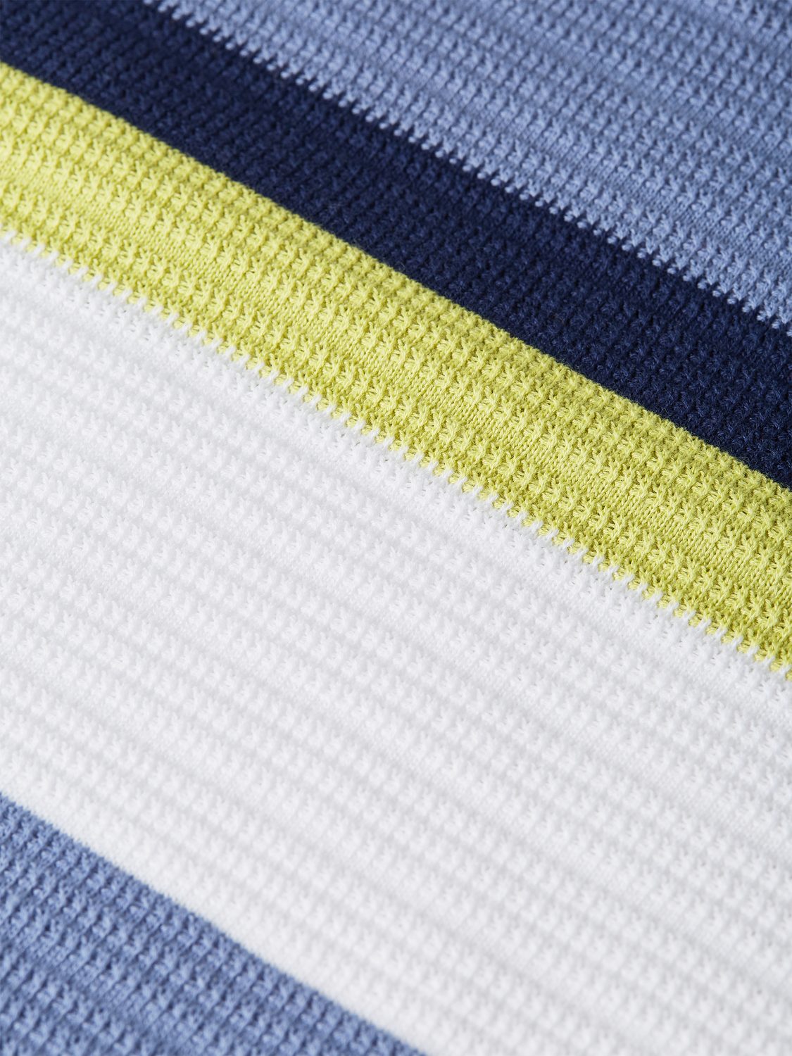 Striped knitted polo shirt from Scotch & Soda, featuring a classic collar and multicolor pattern.