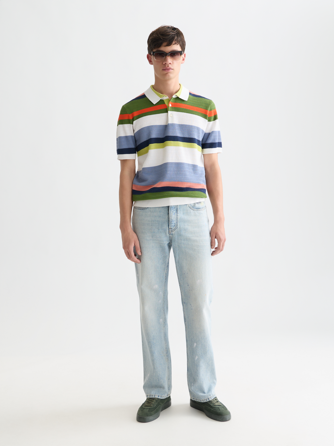 Striped knitted polo shirt by Scotch & Soda, featuring a classic collar and multicolor stripes, casual and stylish for everyday wear.