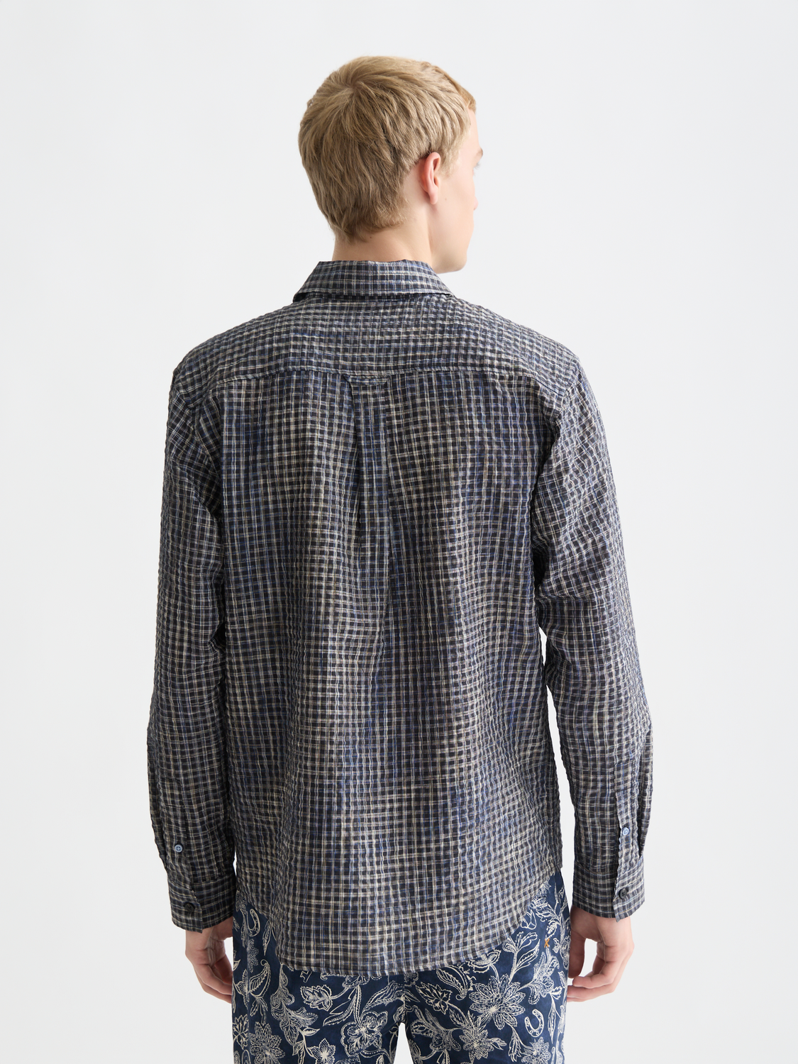 Blue seersucker micro-check long-sleeve shirt by Scotch & Soda with a classic collar and button closure.