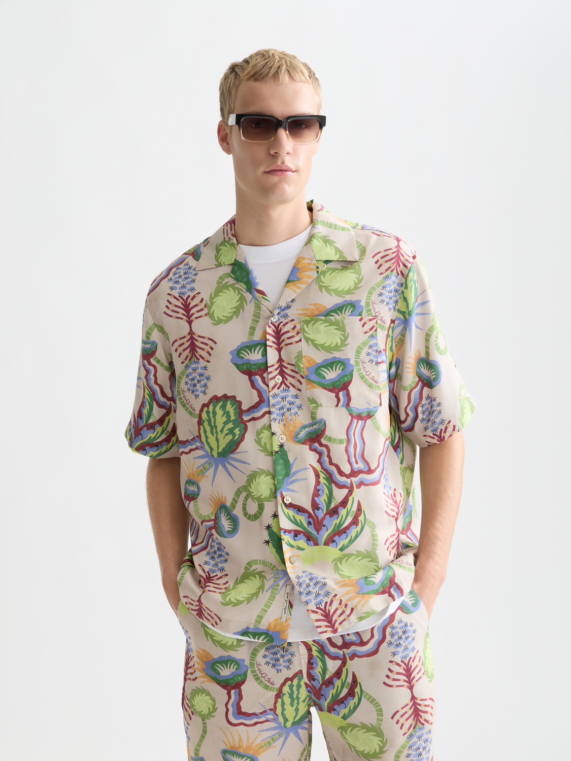 Printed short-sleeved shirt by Scotch & Soda with vibrant floral pattern, front view showcasing the stylish design.