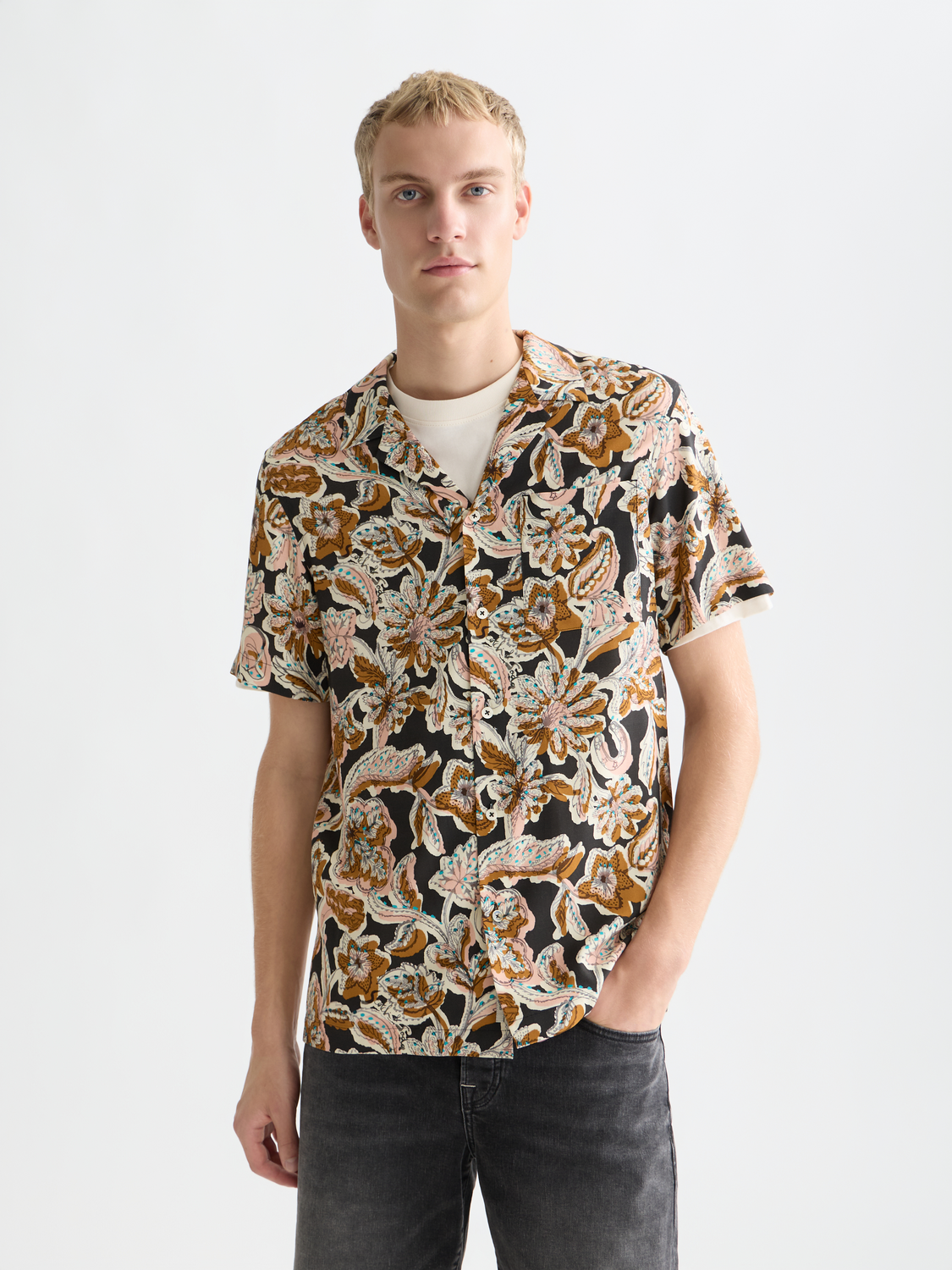 Printed Scotch & Soda short-sleeved shirt with vibrant pattern, lightweight fabric, and classic collar design.