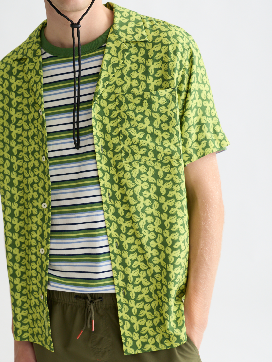 Printed short-sleeved shirt by Scotch & Soda featuring vibrant patterns and casual fit, ideal for summer wear.