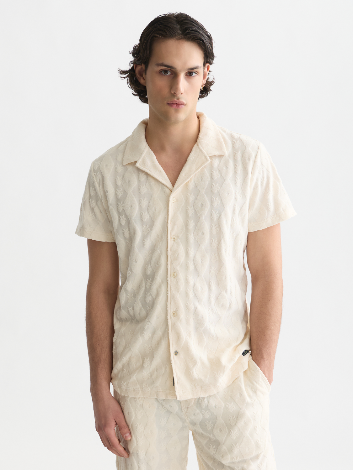 Scotch & Soda terry jacquard short-sleeved shirt with intricate pattern, lightweight fabric, and classic collar design.