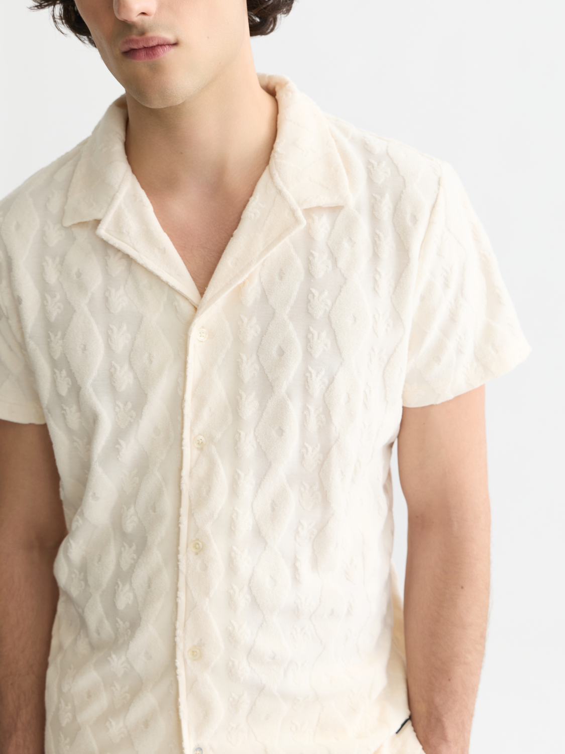 Scotch & Soda terry jacquard short-sleeved shirt with intricate pattern, lightweight fabric, and classic collar design.
