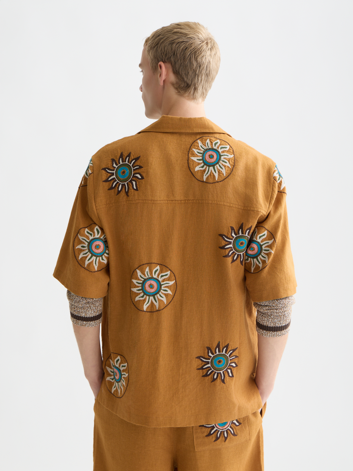 Embroidered linen short-sleeved shirt by Scotch & Soda displayed from the back, featuring intricate embroidery and relaxed fit.