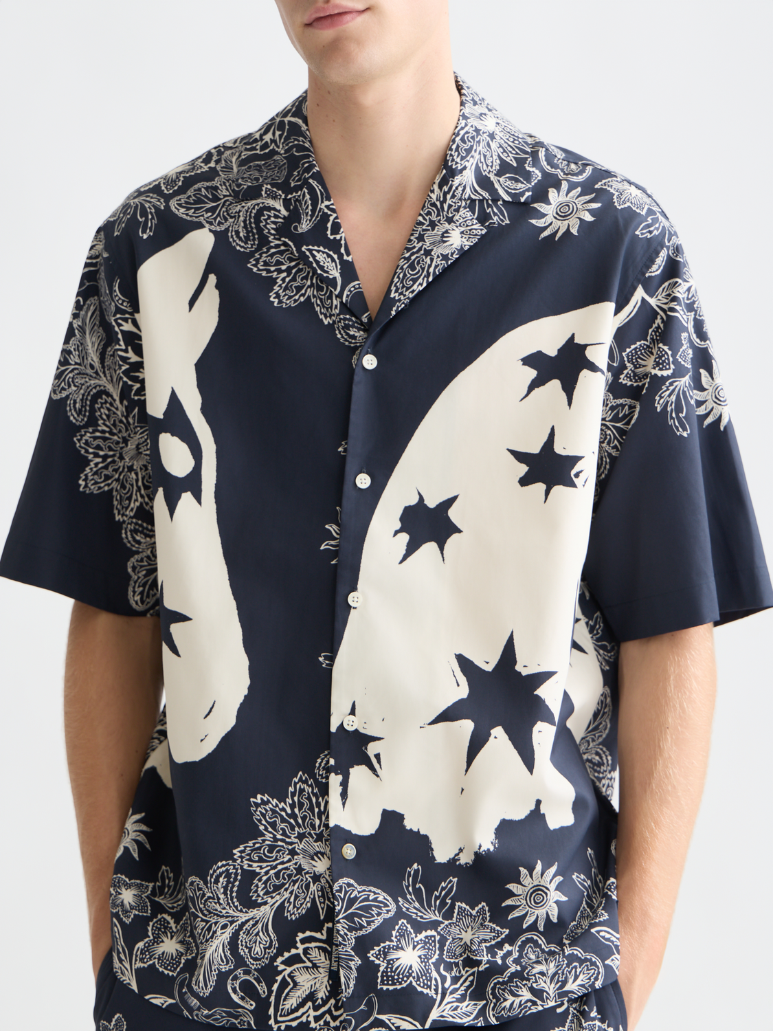 Printed Scotch & Soda short-sleeved shirt with colorful floral pattern, casual summer style, front view.