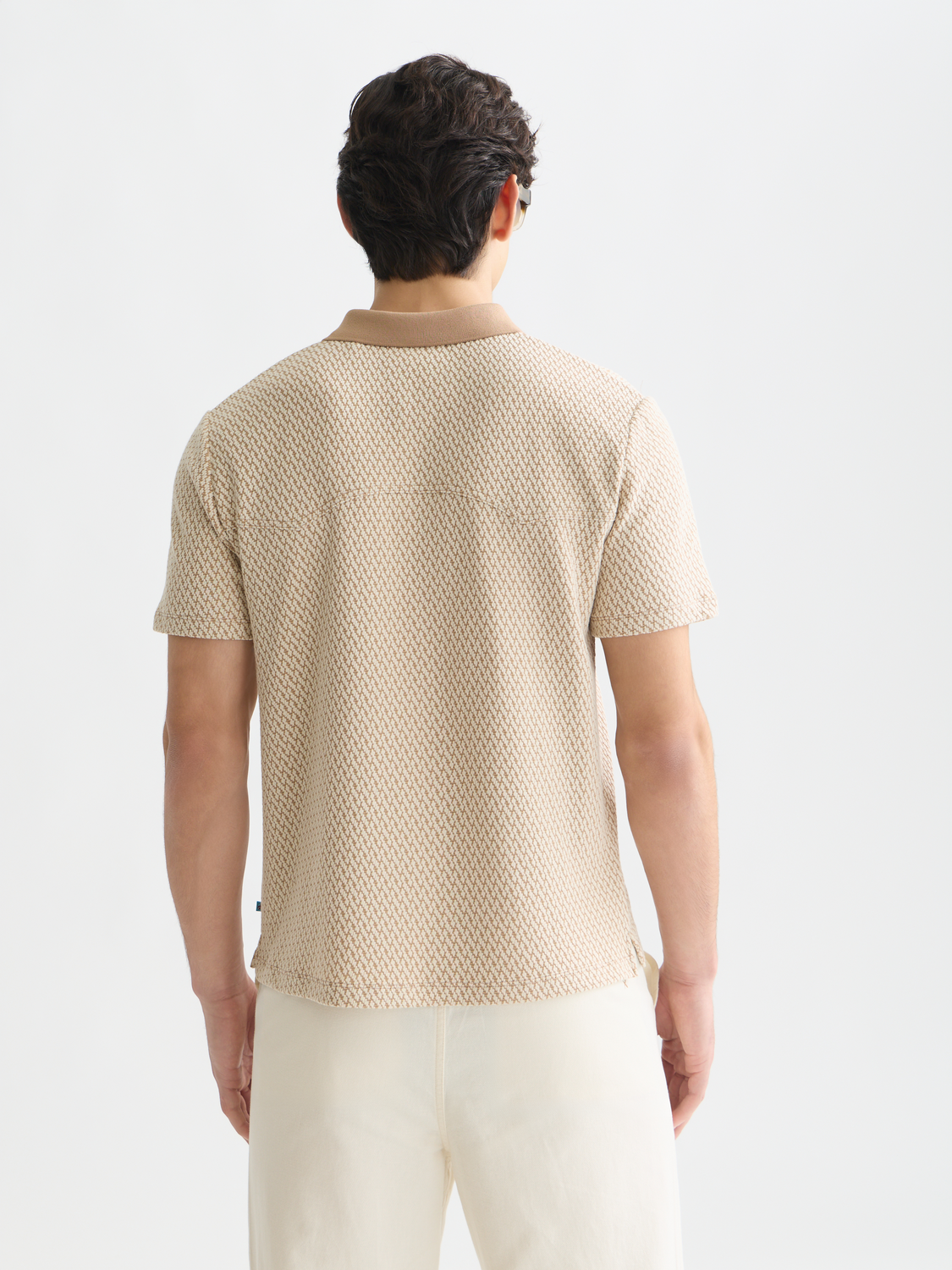 Scarlet red Scotch & Soda jacquard polo shirt with detailed knit pattern and classic collar, shown from the back view.