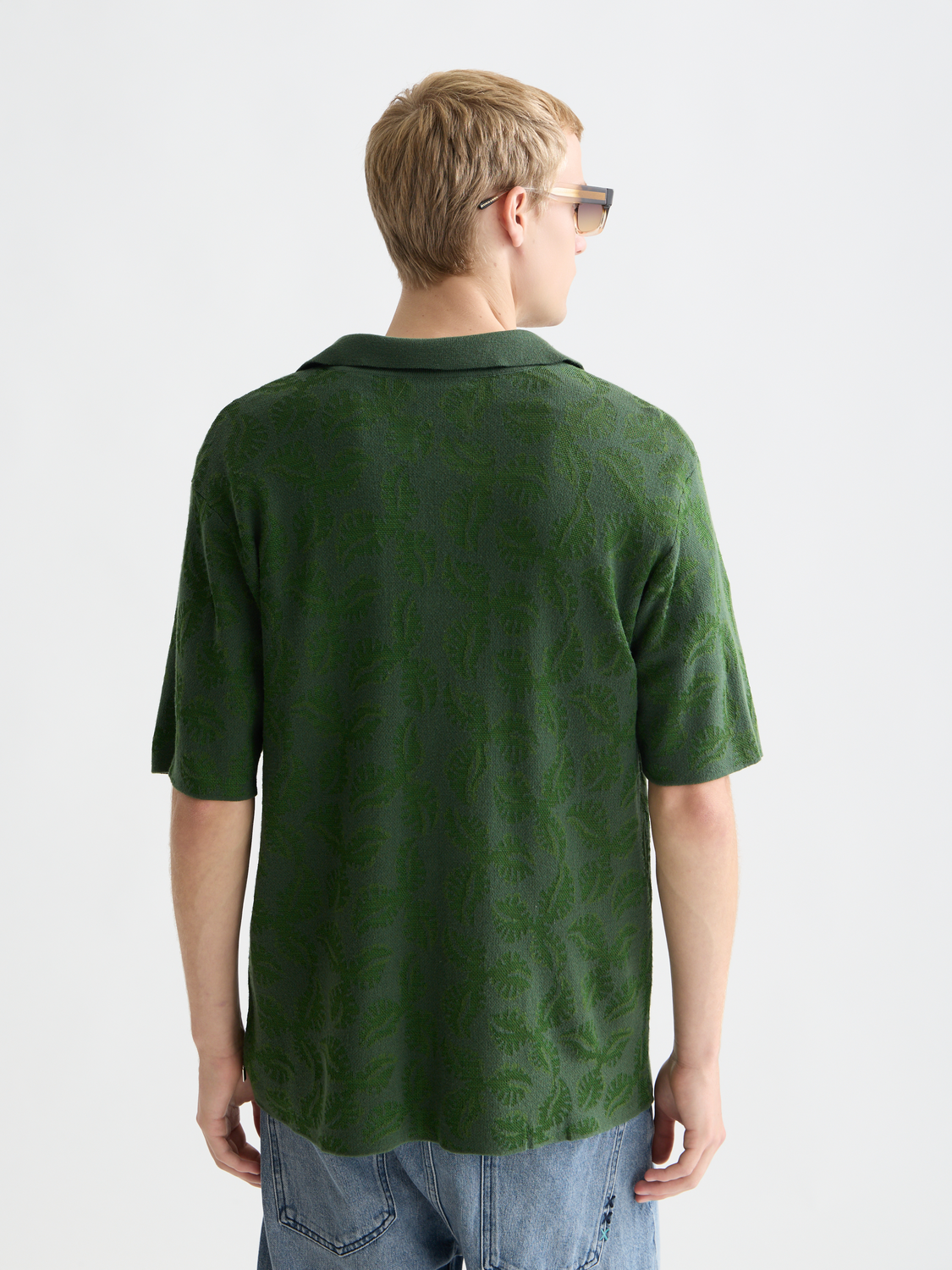 Knitted jacquard short-sleeved shirt from Scotch & Soda, featuring intricate patterns and a comfortable knitwear design.