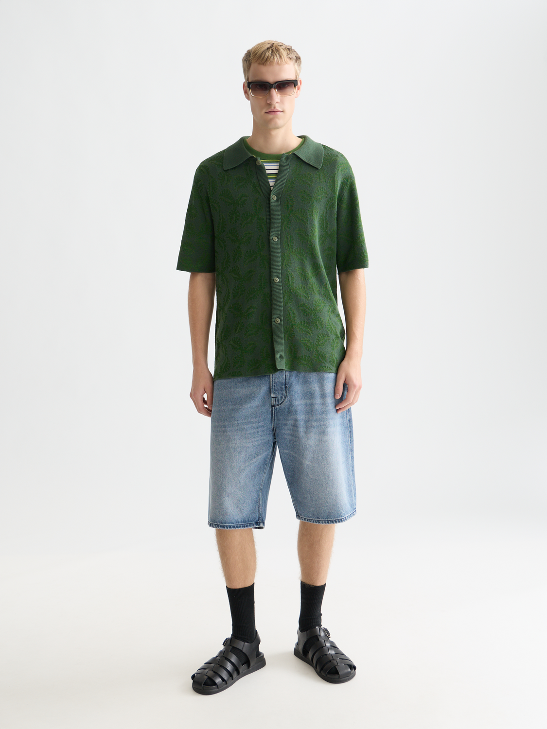 Knitted jacquard short-sleeved shirt from Scotch & Soda, featuring intricate knitwear pattern and short sleeves.