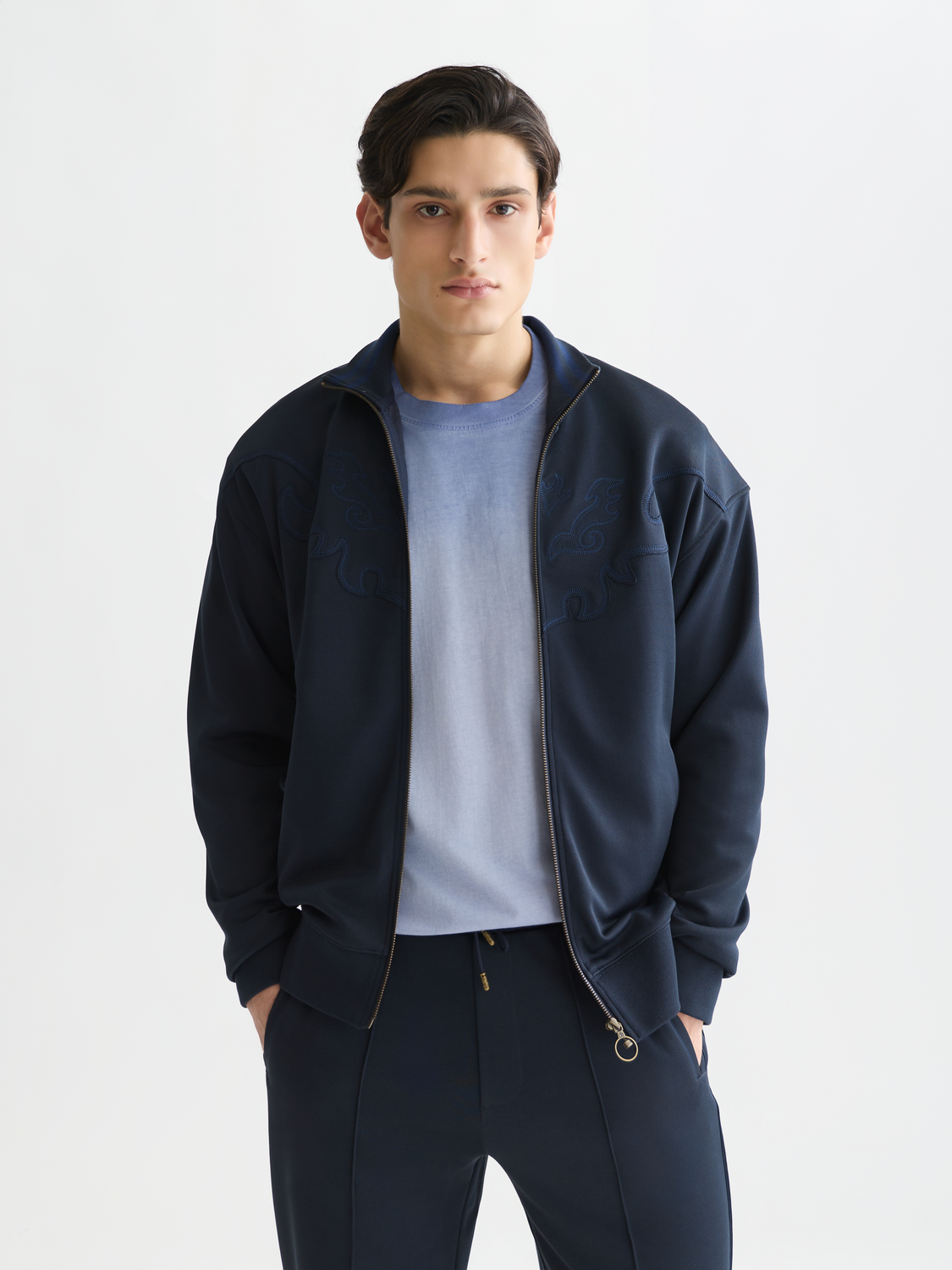 SCOTCH & SODA interlock zip-through sweatshirt in a vibrant color, shown with a front view highlighting the hoodie and zipper details.