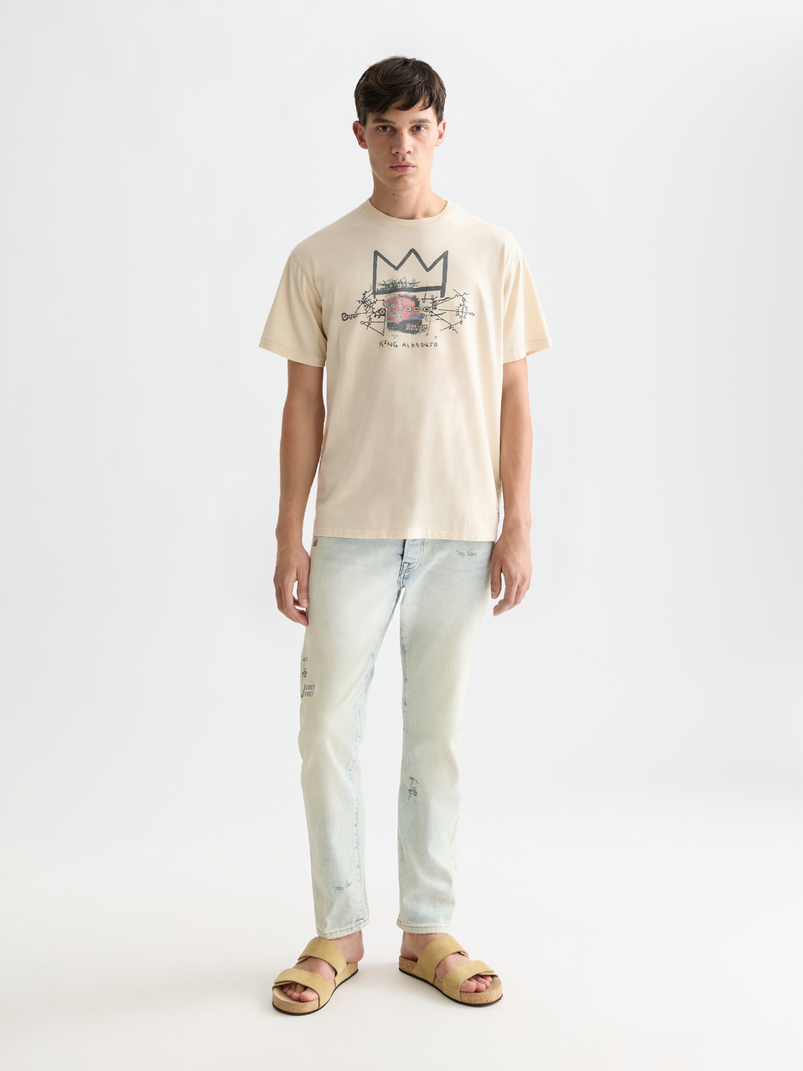 Short-sleeve Scotch & Soda t-shirt featuring Jean-Michel Basquiat artwork, with bold graphic print on front.