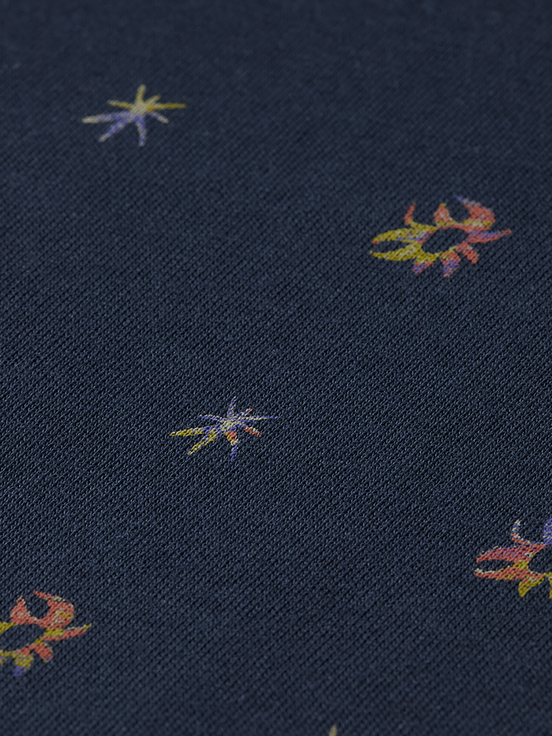 Printed SCOTCH & SODA short-sleeve t-shirt with colorful graphic design on soft fabric, displayed flat.