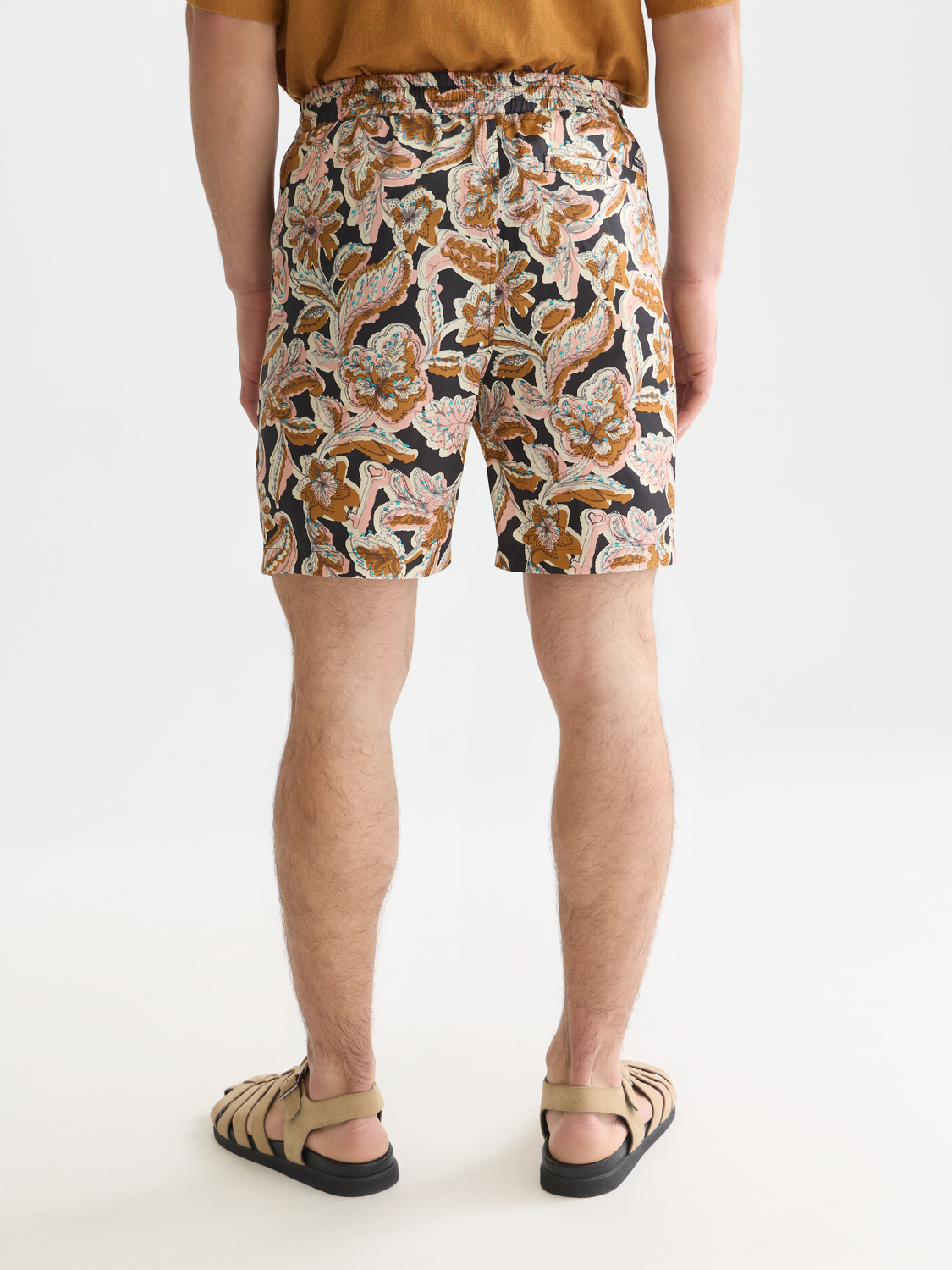 Scotch & Soda Fave printed shorts with colorful floral pattern and relaxed fit, shown from back view.