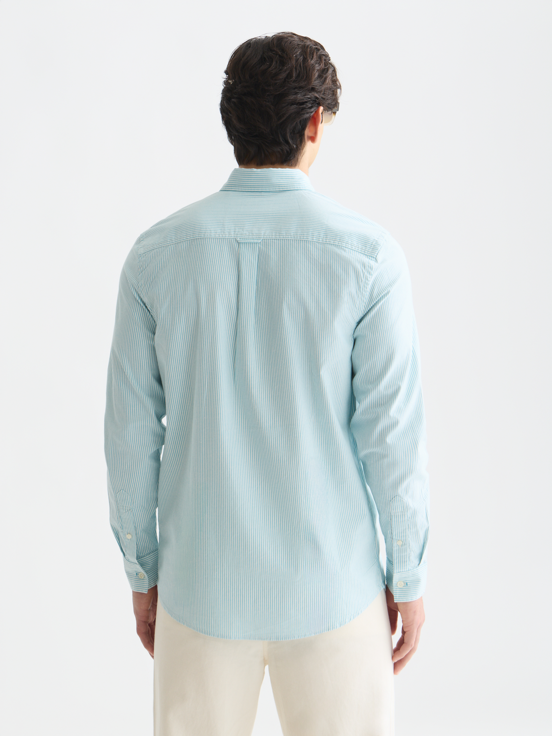 Long sleeve striped Oxford shirt by Scotch & Soda, featuring classic pattern and button-up design, shown from the back.