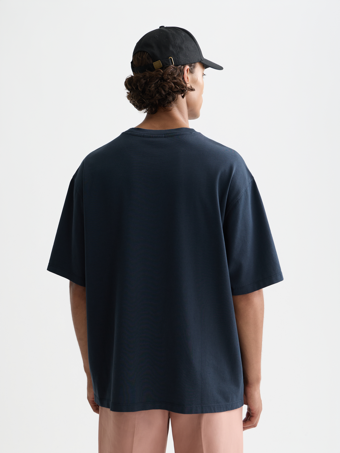 Short sleeve t-shirt featuring cross-stitched artwork from Scotch & Soda, displayed on a dark background.