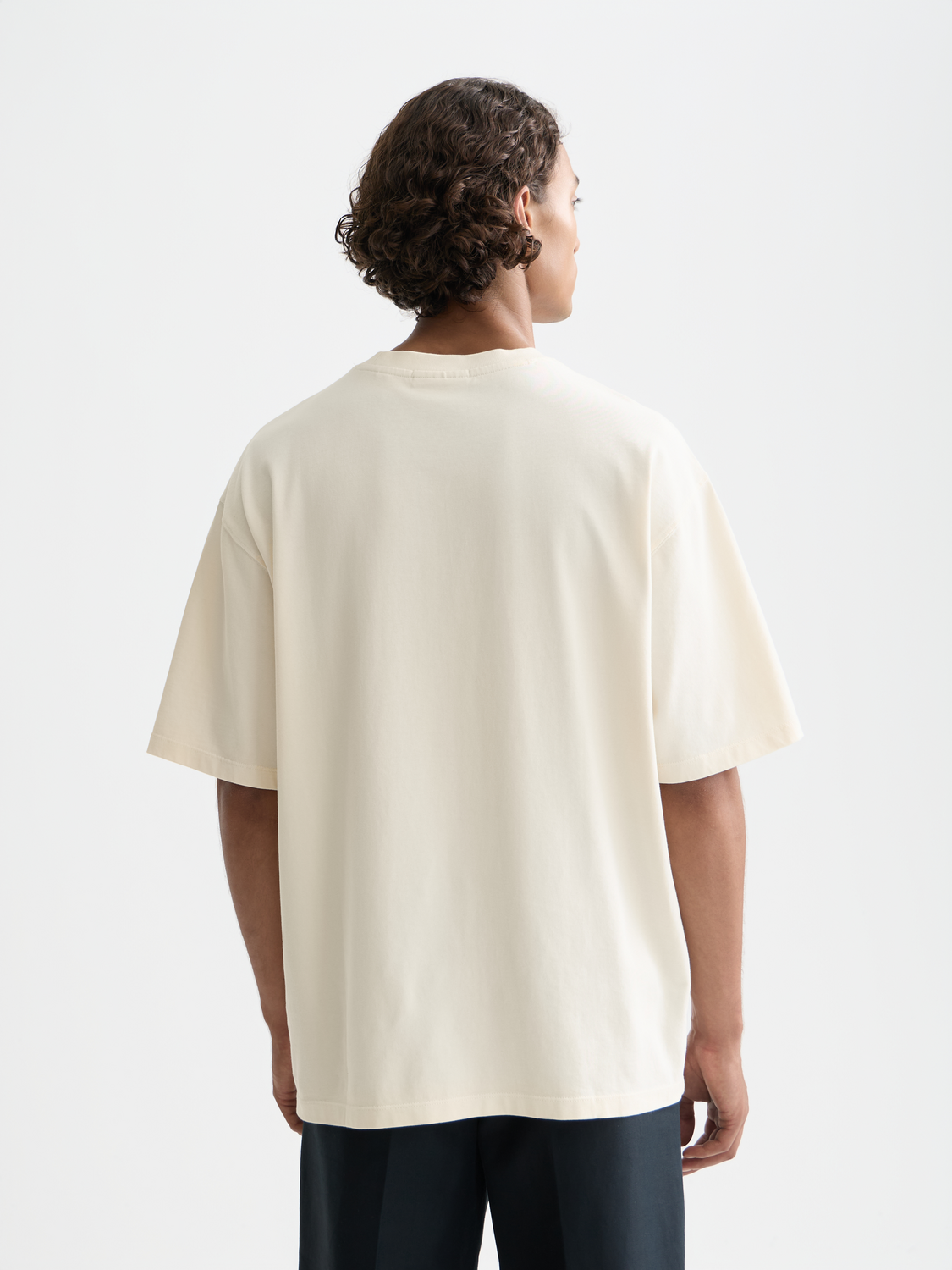 Short-sleeve Scotch & SODA t-shirt with cross-stitched artwork design on front, casual and stylish men's apparel.