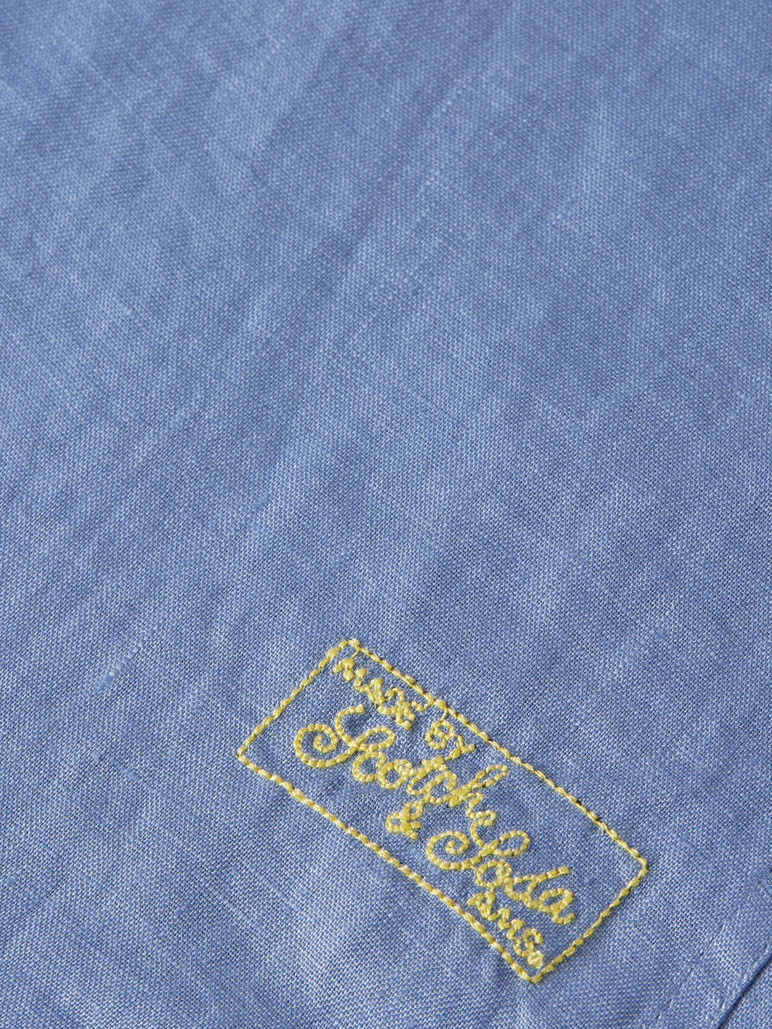 Long-sleeve linen shirt by Scotch & Soda, soft fabric with a relaxed fit, shown in a natural light setting.