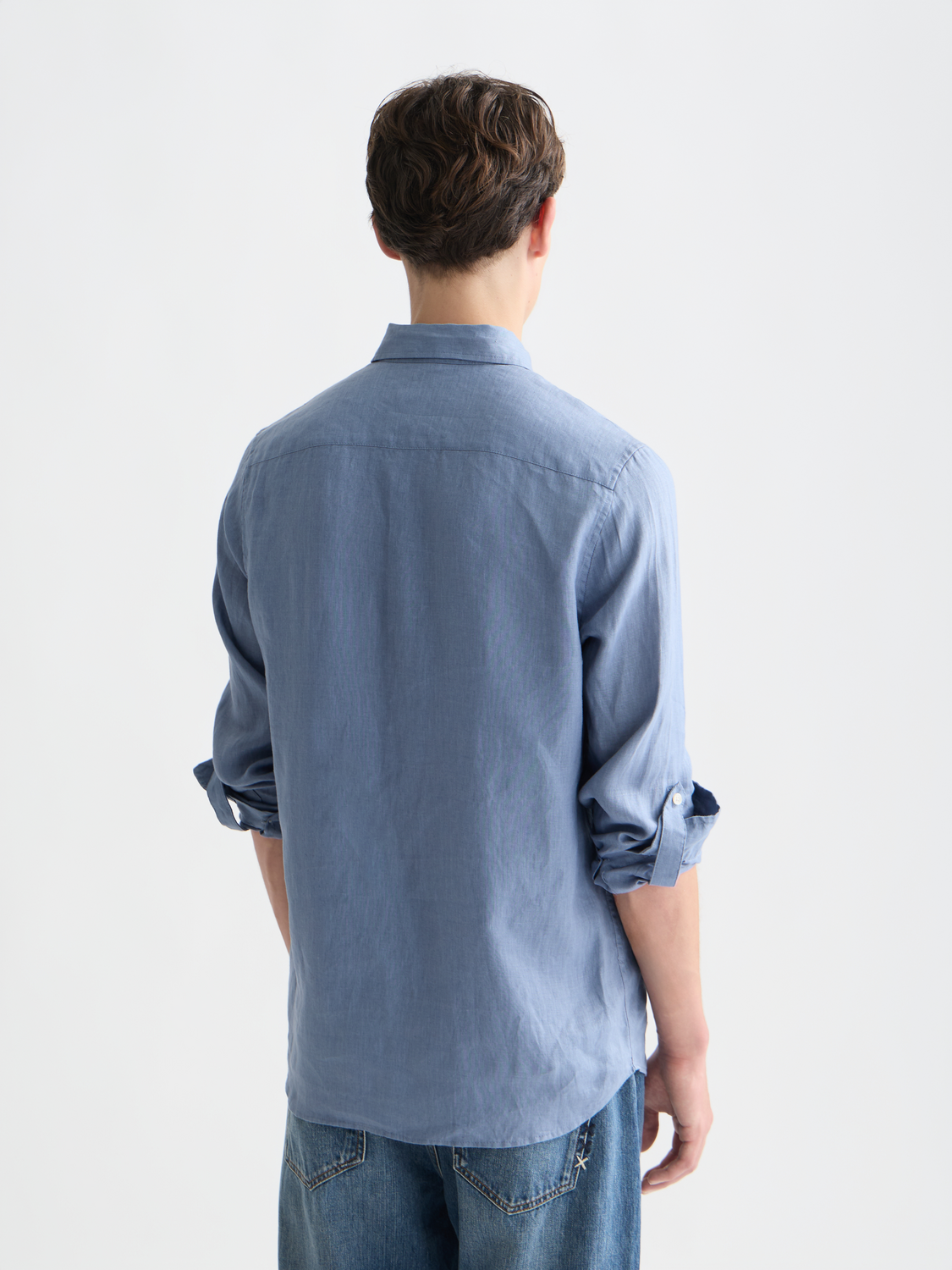 Long sleeve linen shirt by Scotch & Soda, shown from the back with a relaxed fit and classic collar in a light, breathable fabric.