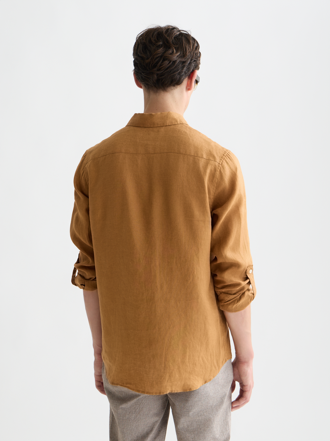 Long sleeve linen shirt by Scotch & Soda featuring a relaxed fit, shown from the back in a natural fabric setting.