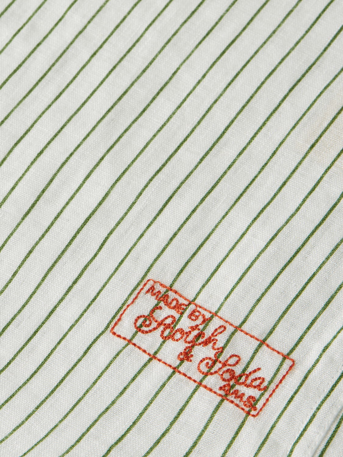 Long sleeve striped linen shirt by Scotch & Soda, showing the lightweight fabric and classic pattern in a casual fit.