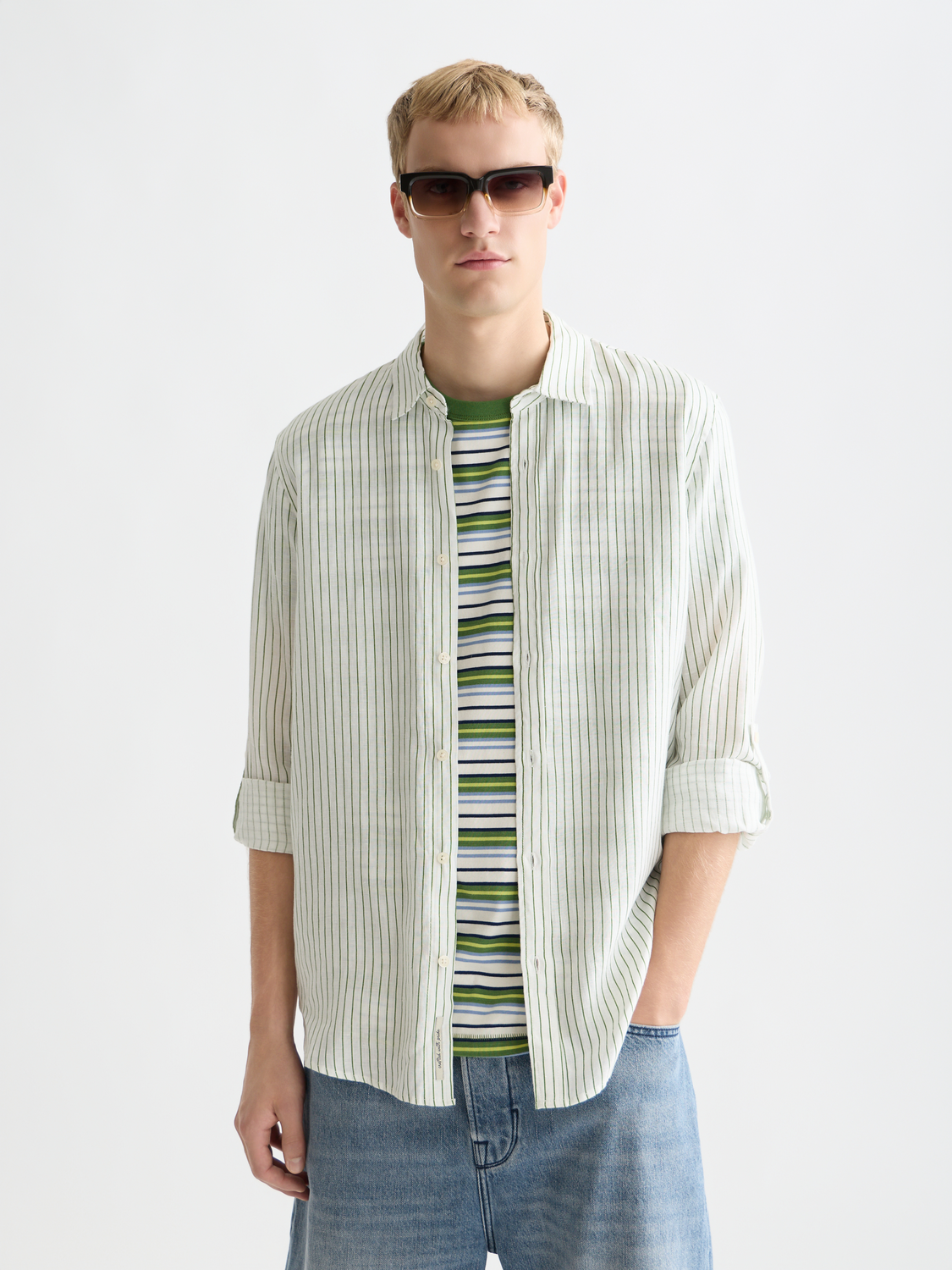 Long-sleeve striped linen shirt by Scotch & Soda, featuring a casual fit and classic pattern, displayed on a hanger.