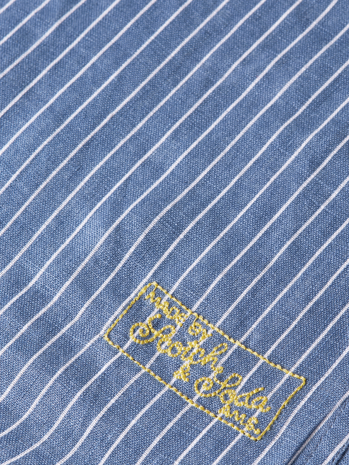 Long-sleeve Scotch & Soda striped linen shirt with vertical blue and white stripes, casual and lightweight for warm weather.