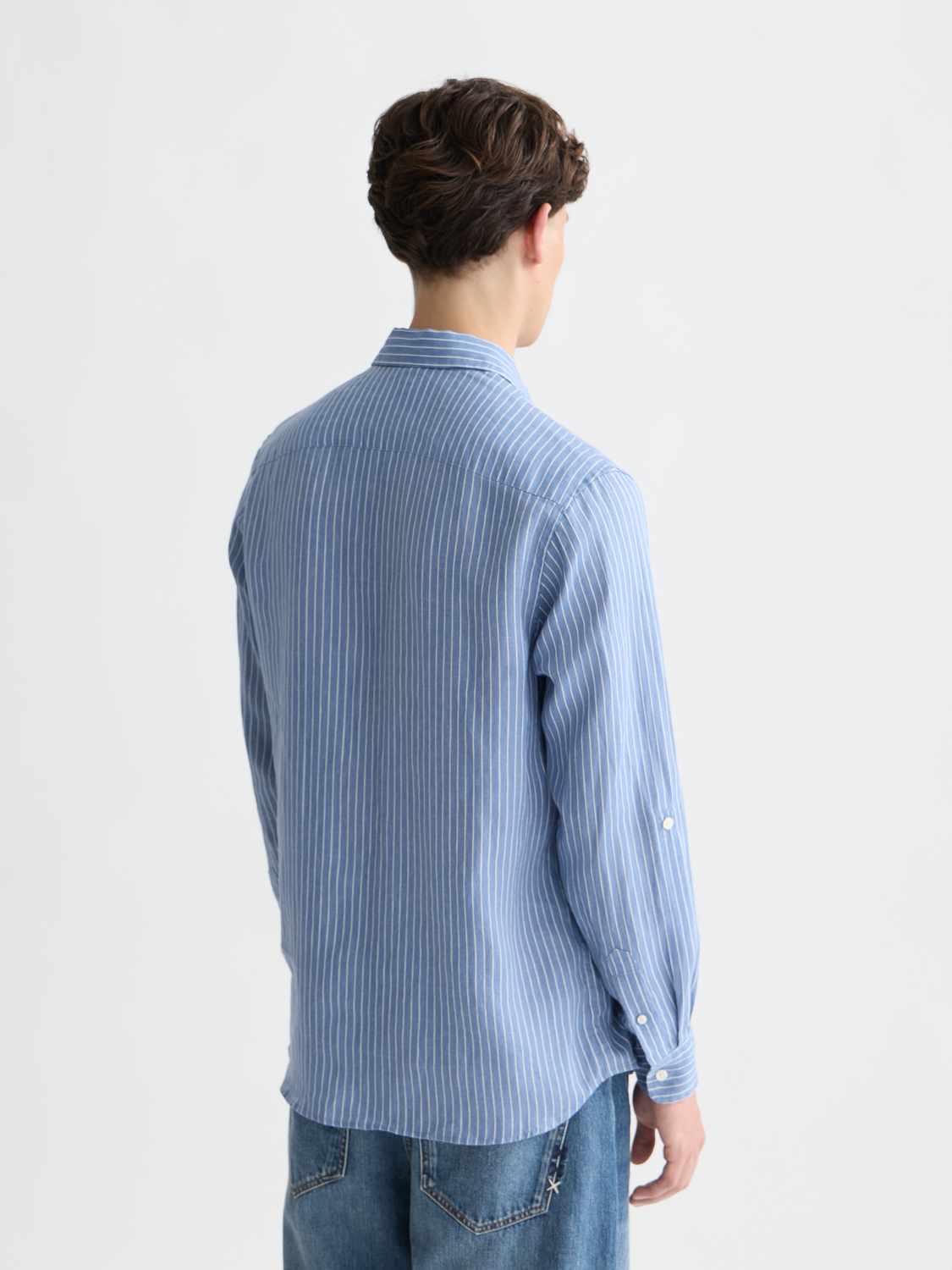 Long-sleeve striped linen shirt by Scotch & Soda with a relaxed fit, shown from the back.