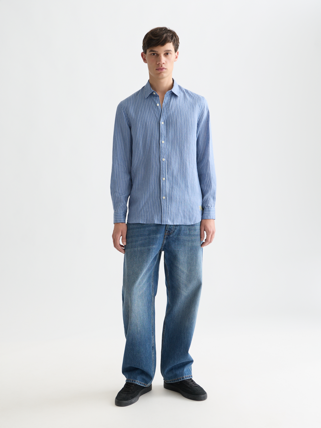 Long sleeve striped linen shirt by Scotch & Soda, featuring a classic pattern and lightweight fabric, shown on a model.