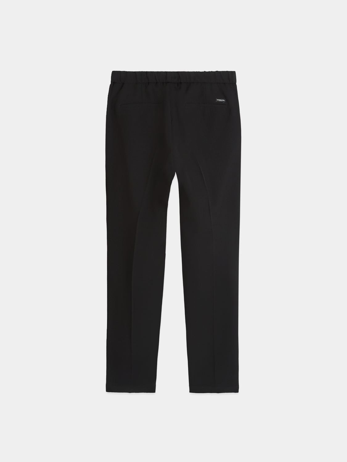 Back view of Scotch & Soda Finch tapered-fit pants in dark fabric, showcasing tailored design and slim fit style.