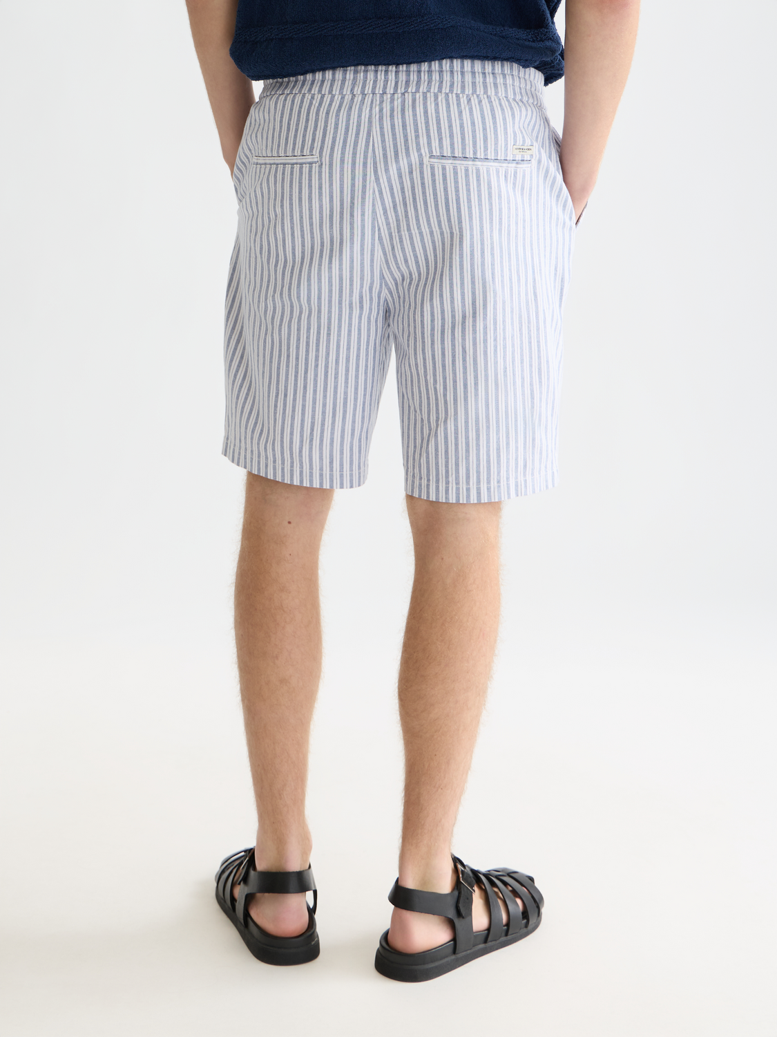 SCOTCH & SODA Fave cotton-linen shorts in cream, back view showing relaxed fit and lightweight fabric for summer wear.