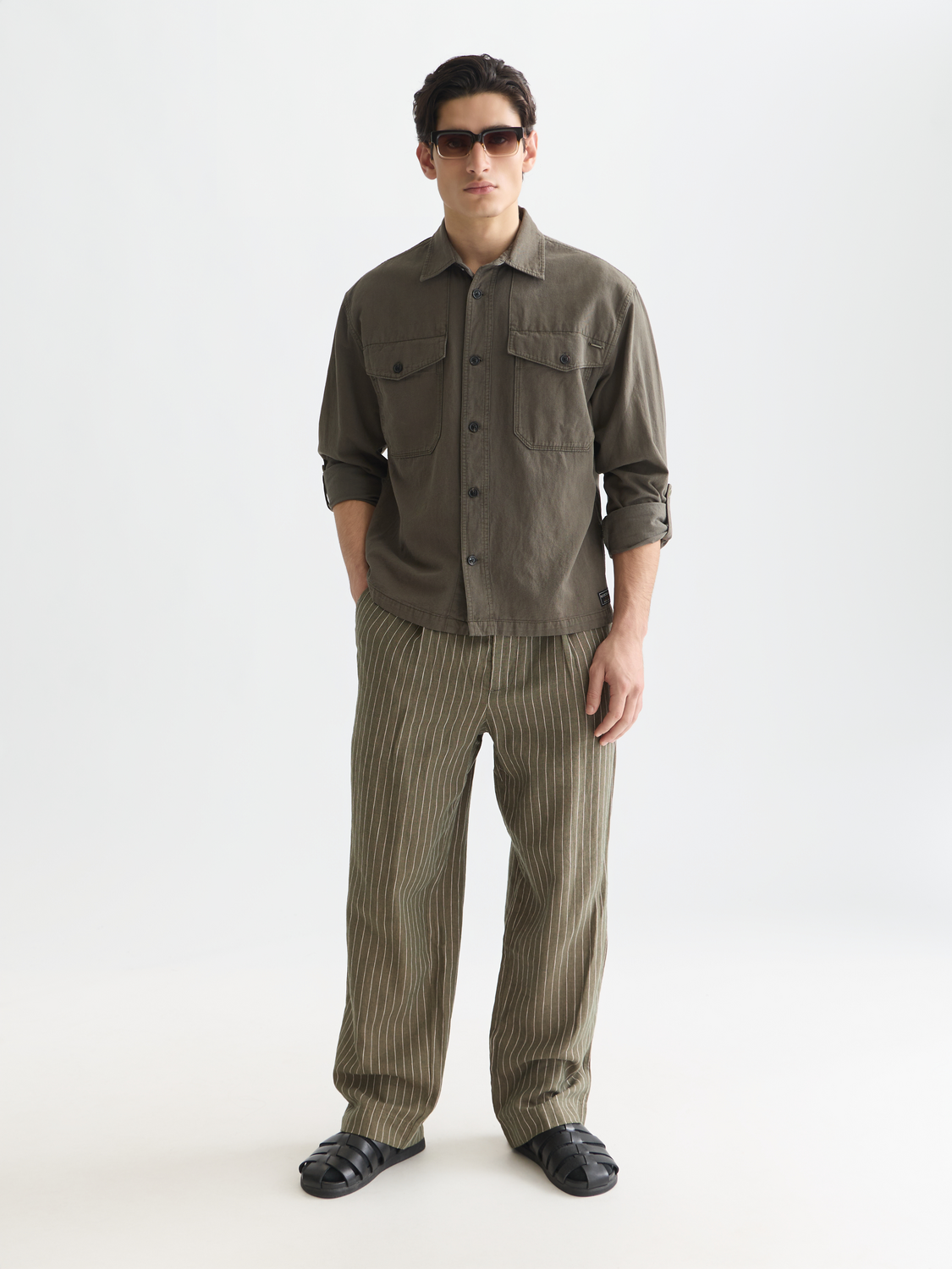 Slim fit Scotch & Soda pleated pinstriped chino pants with front view, showcasing classic design and tailored style.