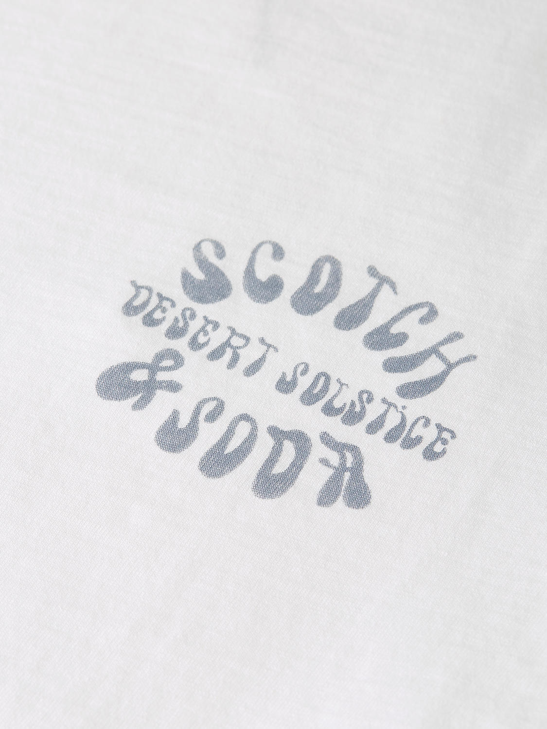 Light-colored Scotch & Soda artwork T-shirt with short sleeves, featuring a graphic design on the front.