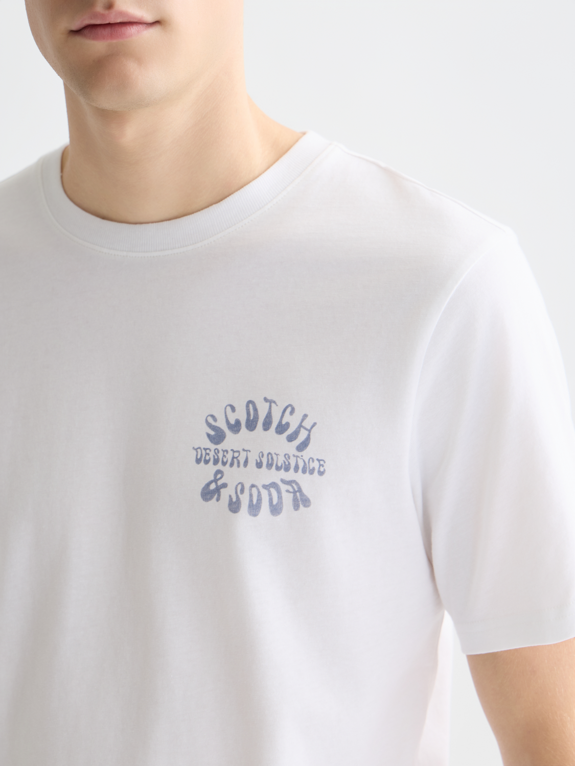 Scotch & Soda men's short sleeve artwork t-shirt with colorful graphic design on soft cotton fabric.