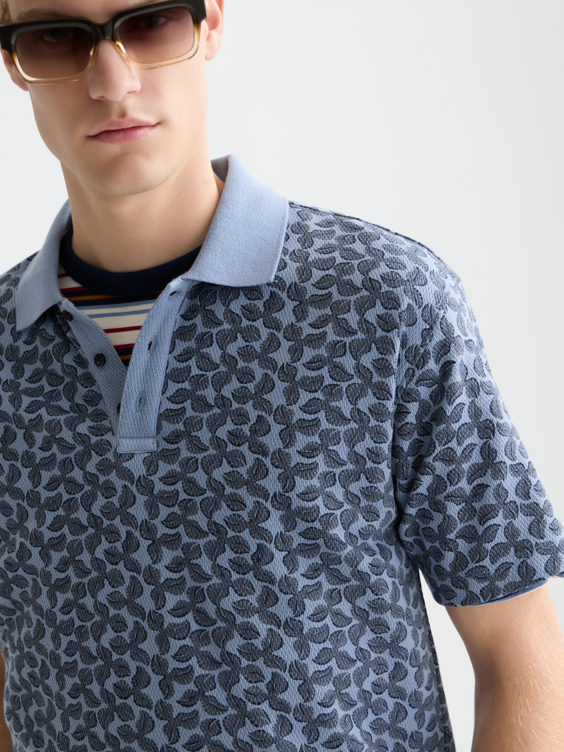 Printed Scotch & Soda polo shirt with a colorful geometric pattern, short sleeves, and a classic collar.
