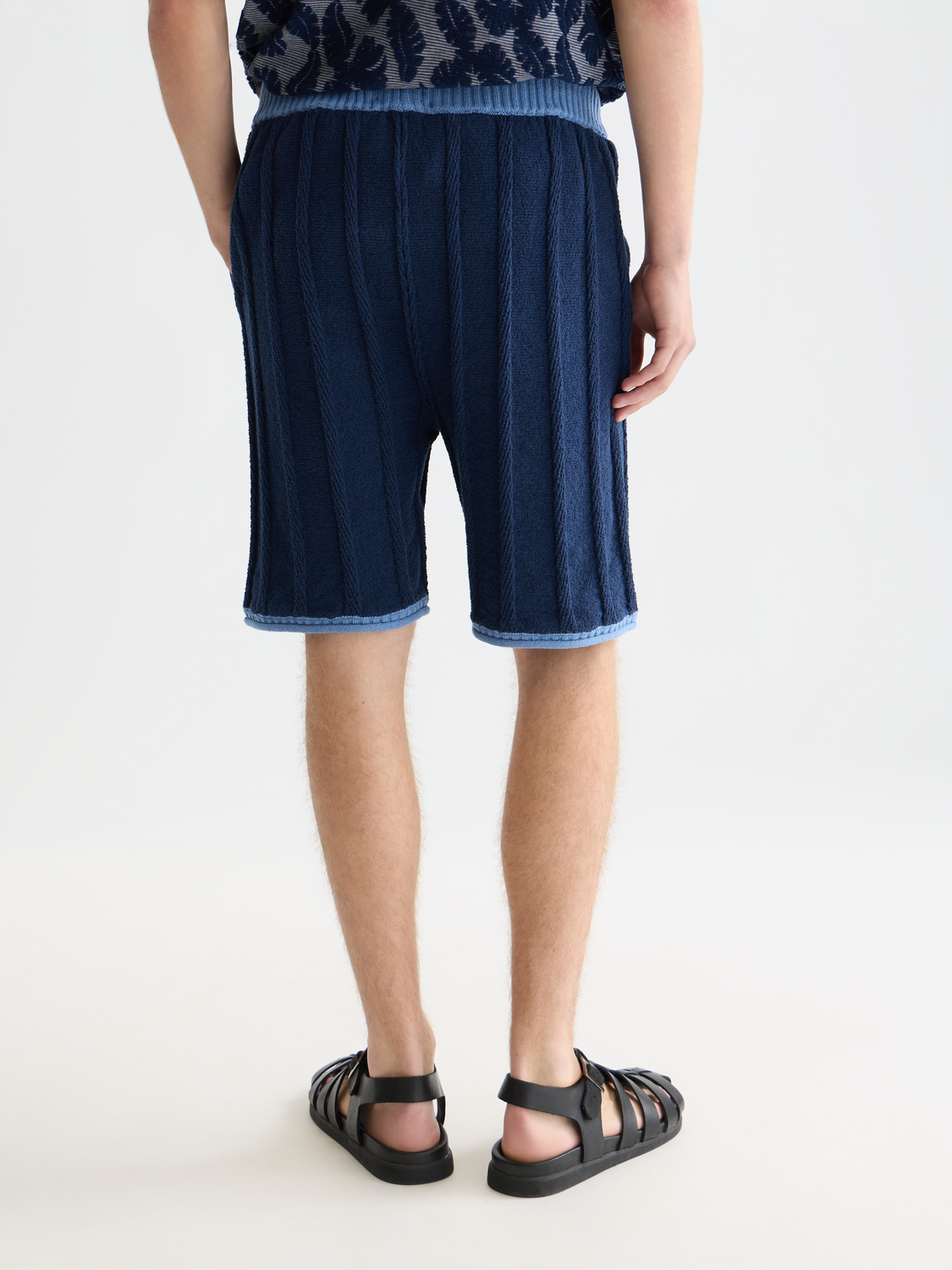 Knitted shorts by Scotch & Soda, showing the back view with a textured fabric and relaxed fit style.