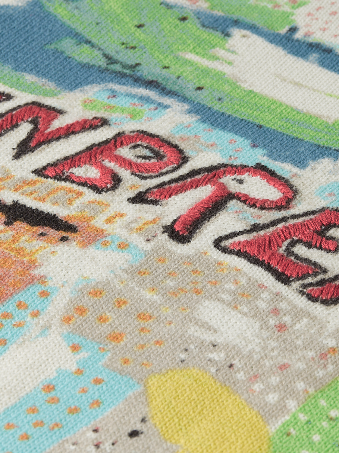 SCOTCH & SODA knitwear pullover featuring S&S x Basquiat printed design, showcasing vibrant artwork on soft fabric.