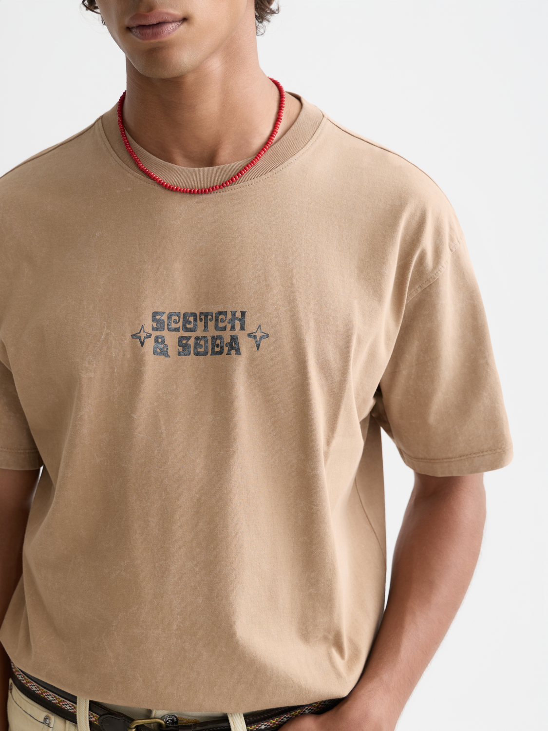 White short-sleeve Scotch & Soda logo t-shirt with graphic design on front, casual fashion tee for men and women.