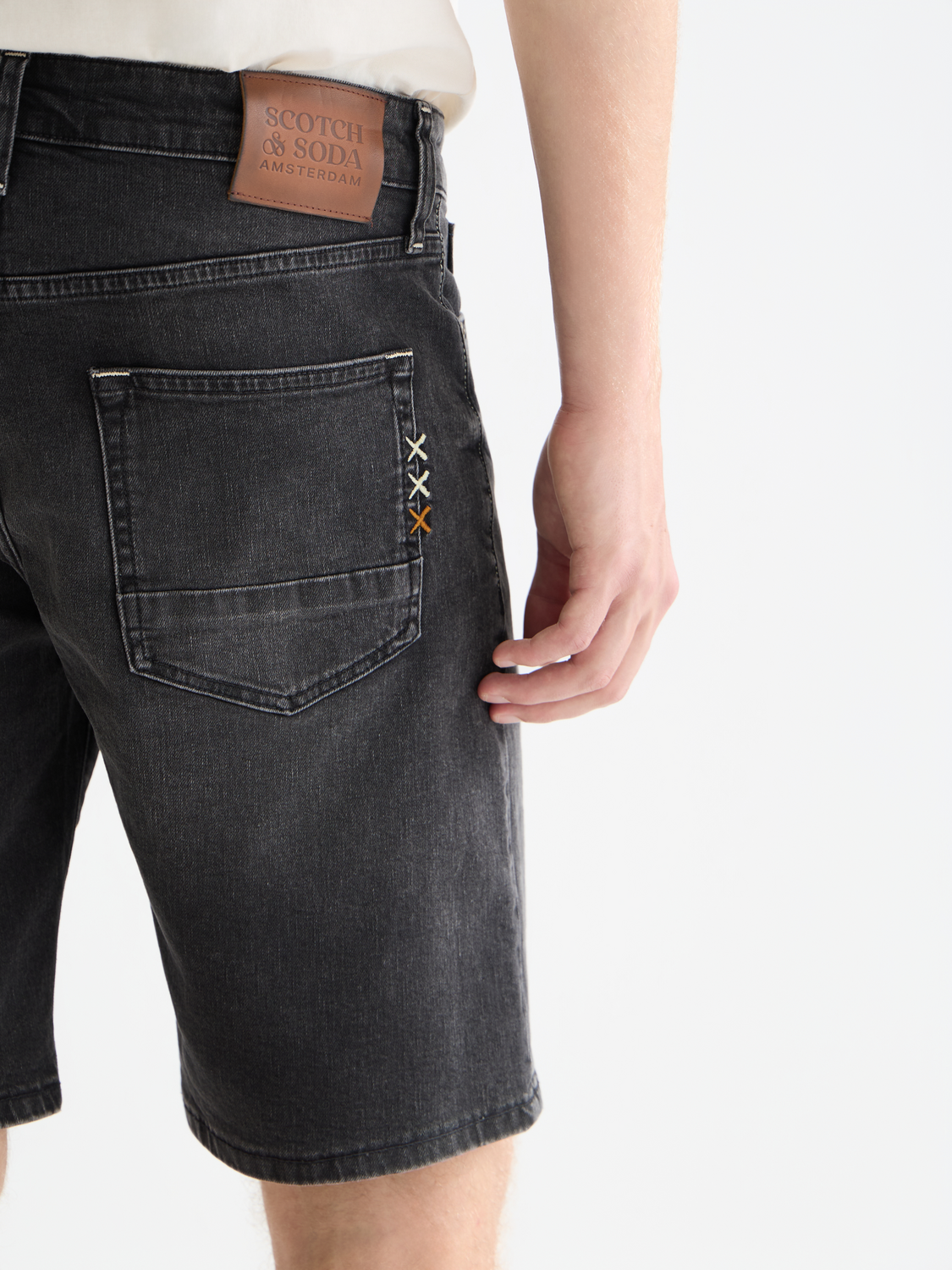 SCOTCH & SODA Ralston denim shorts with distressed details, classic five-pocket style, shown on a neutral background.