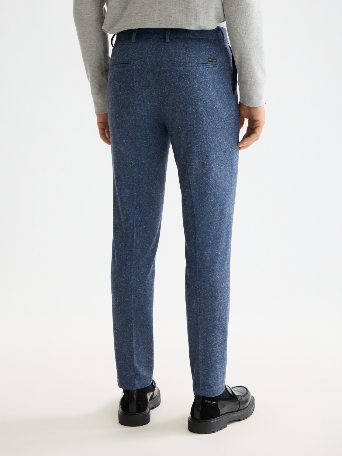 Scotch & Soda Stuart slim-fit chinos in dark gray, back view showing tailored pants with belt loops and neat stitching.