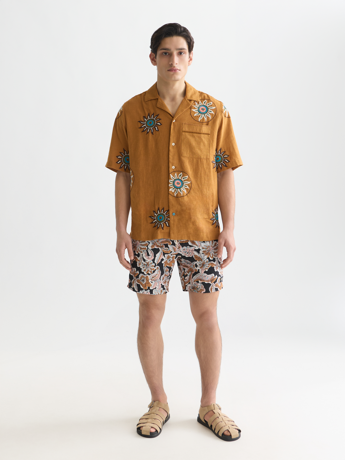 Printed SCOTCH & SODA swimshorts with colorful patterns, stylish swimwear for men, shown in a front view.