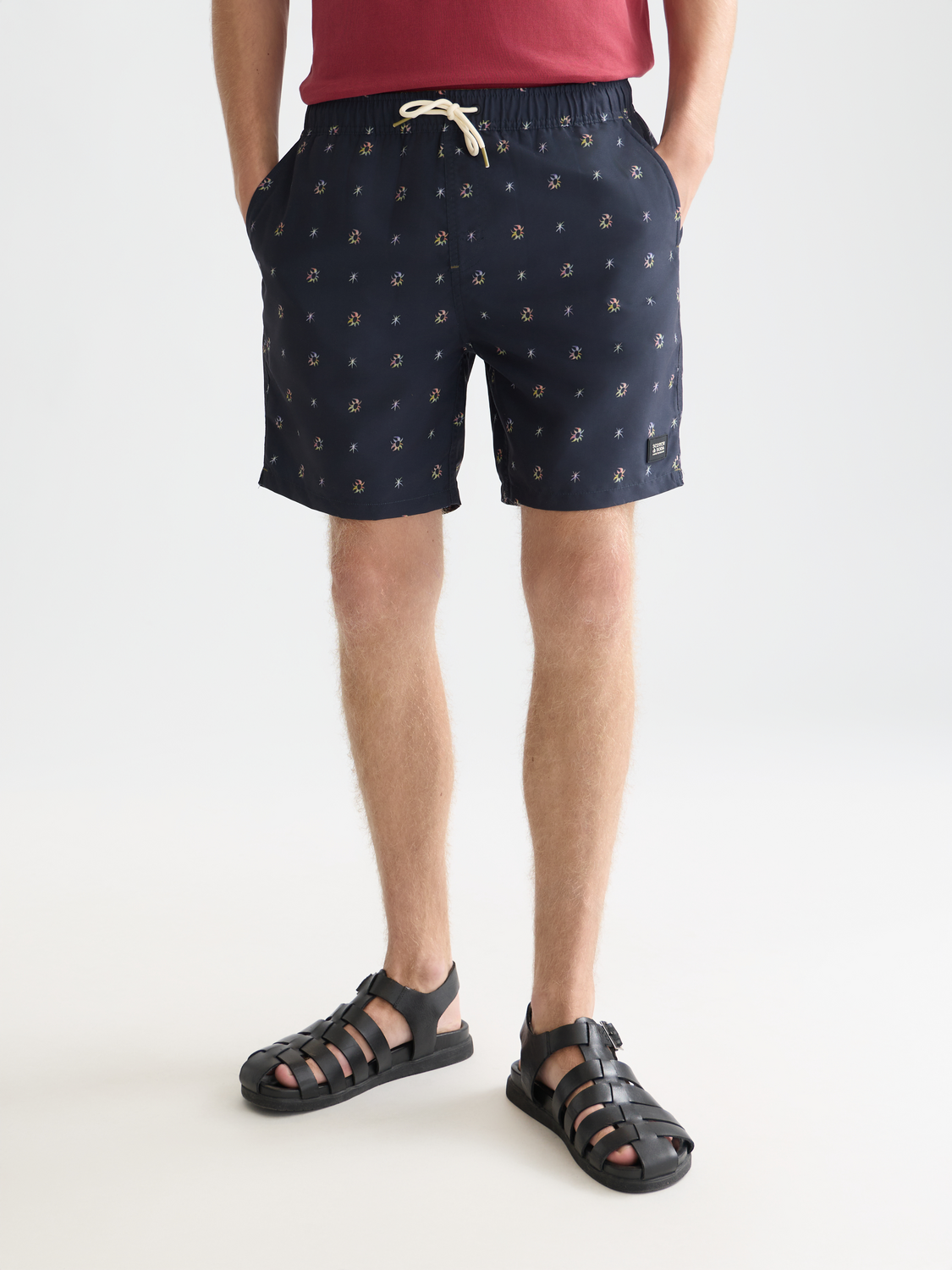 Printed swimshorts from Scotch & Soda, featuring vibrant patterns and a comfortable fit, designed for beach or poolside wear.