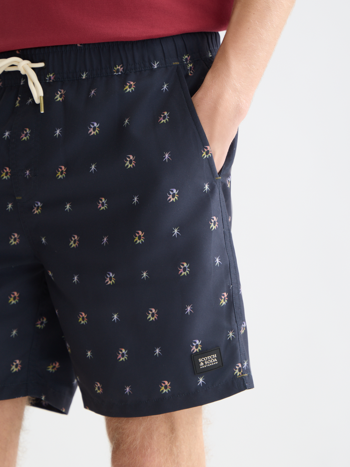 Printed SCOTCH & SODA swimshorts with vibrant pattern, elastic waistband, and side pockets, designed for swimwear and beachwear.